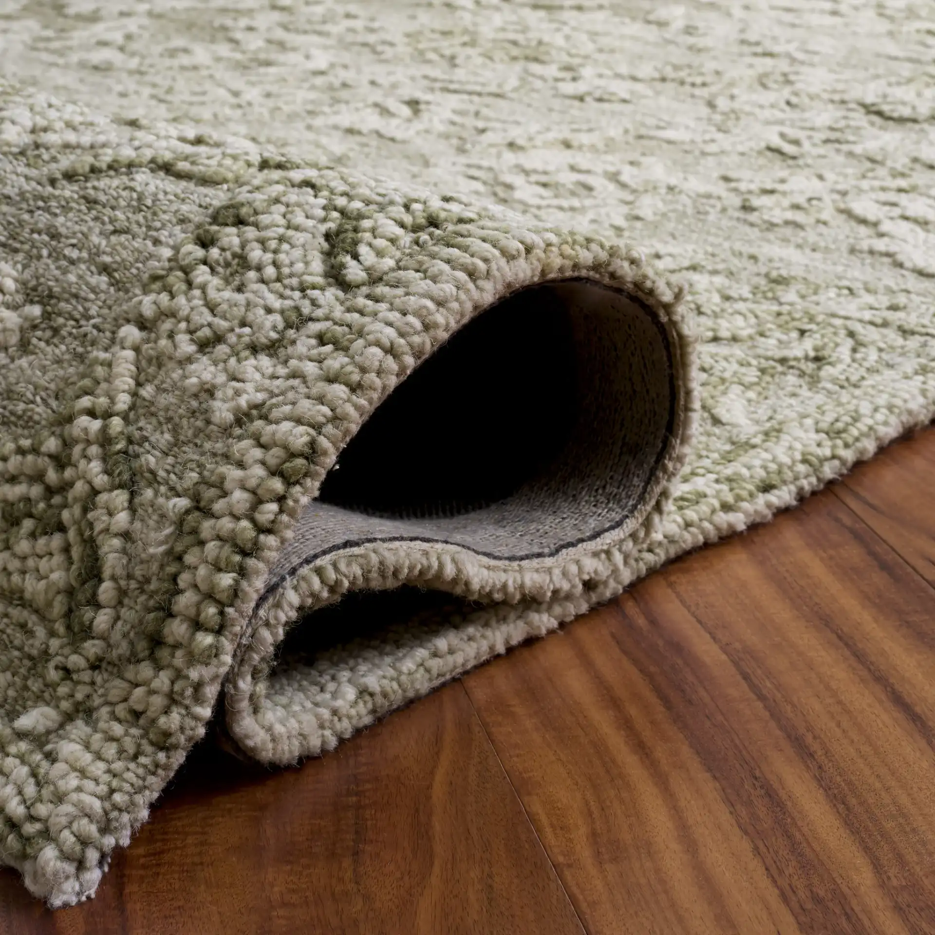 Blossom Damask Vine Hand-Tufted Wool Rug in Sage / Ivory in a styled room