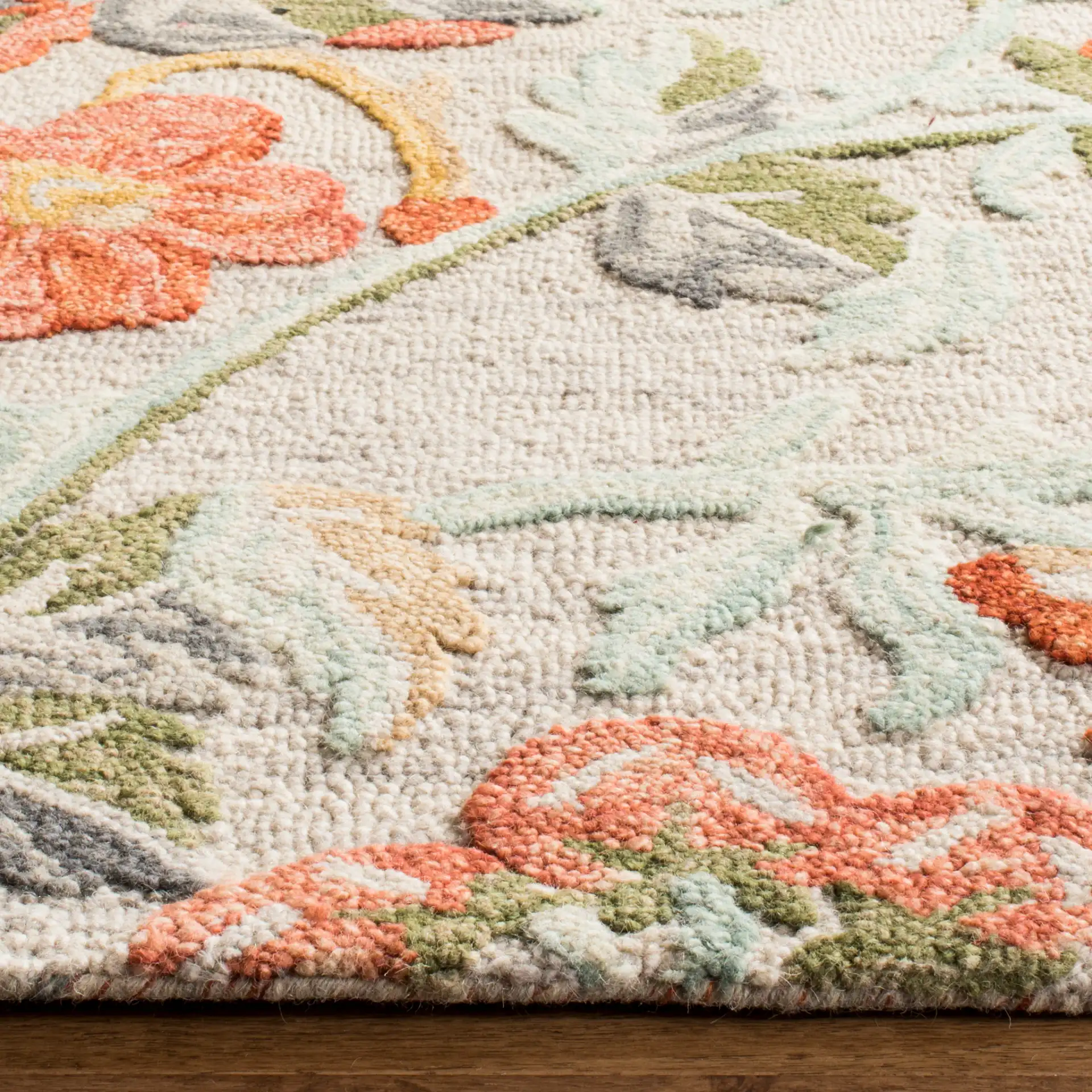 Blossom Floral Branch Hand-Tufted Wool Rug in Gray / Red in a styled room