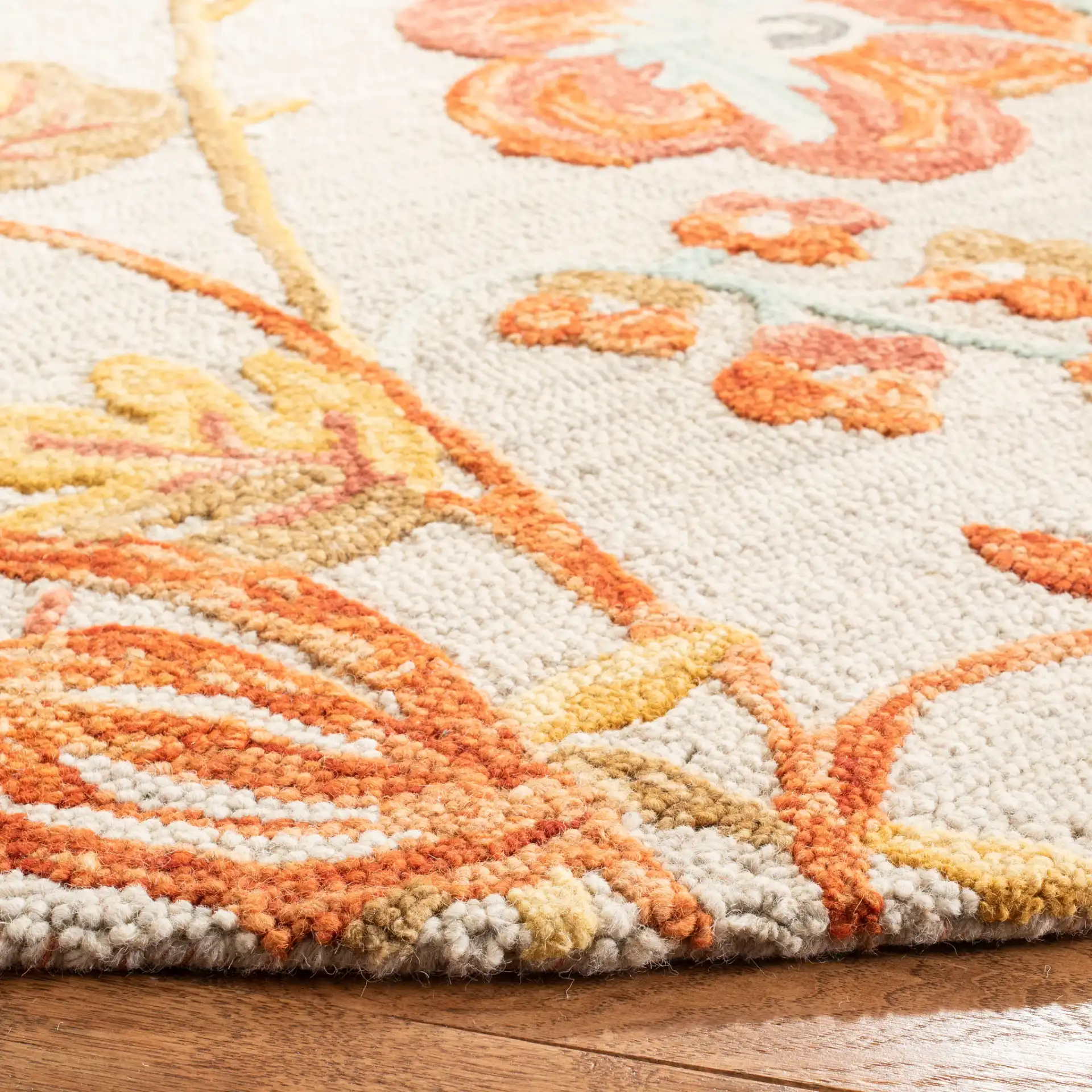 Blossom Floral Branch Hand-Tufted Wool Rug in Gray / Red in a styled room