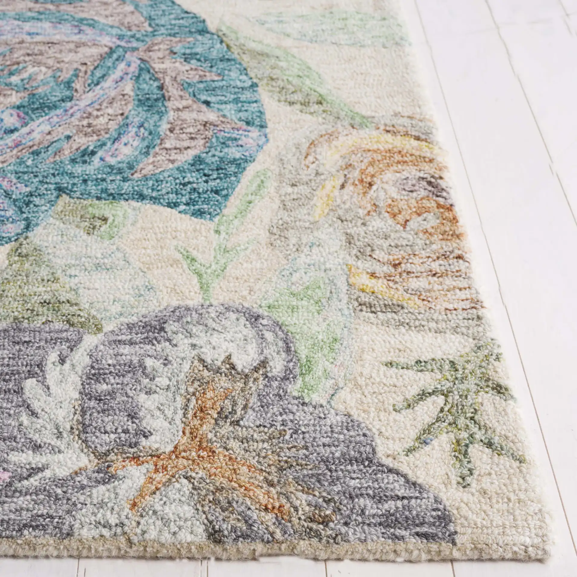 Blossom Scattered Floral Hand-Tufted Wool Rug in Green / Pink in a styled room