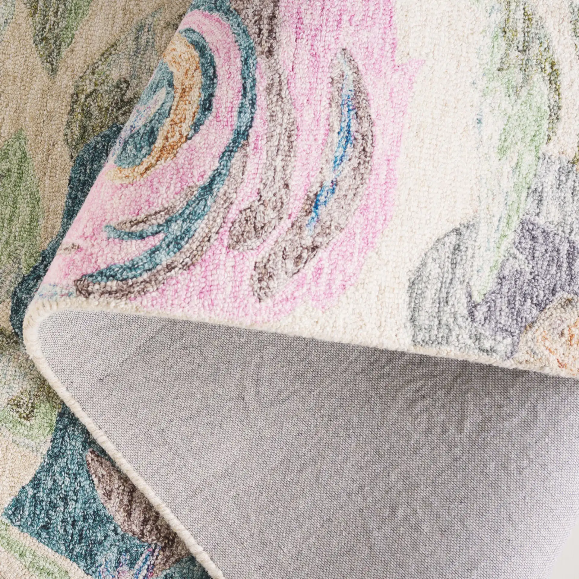 Blossom Scattered Floral Hand-Tufted Wool Rug in Green / Pink in a styled room