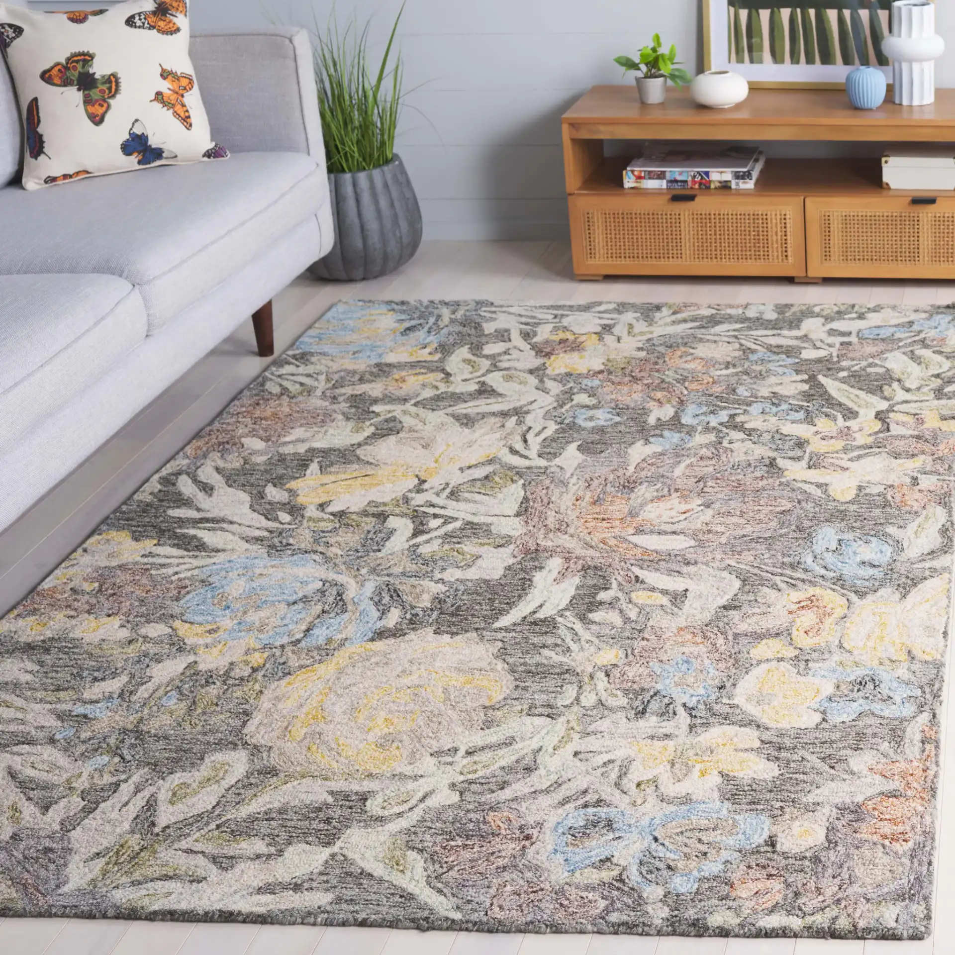 Blossom Distressed Floral Hand-Tufted Wool Rug in Green / Charcoal in a styled room