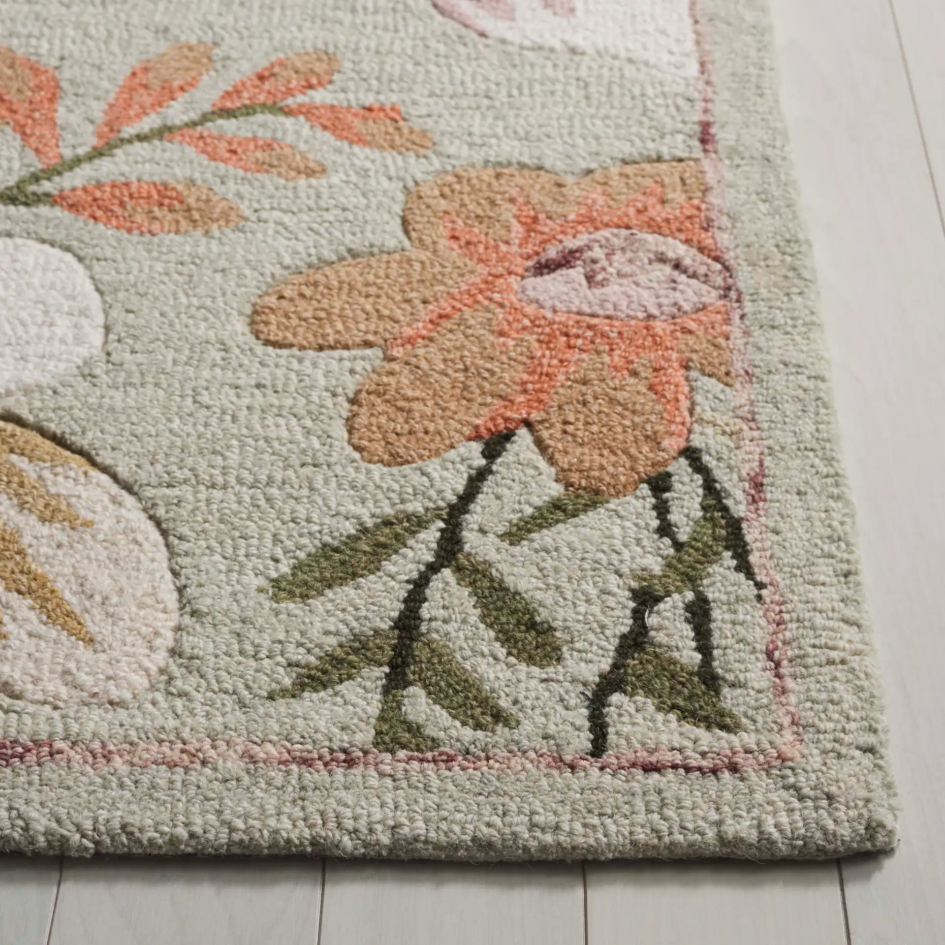 Blossom Floral Sprig Hand-Tufted Wool Rug in Sage / Ivory in a styled room