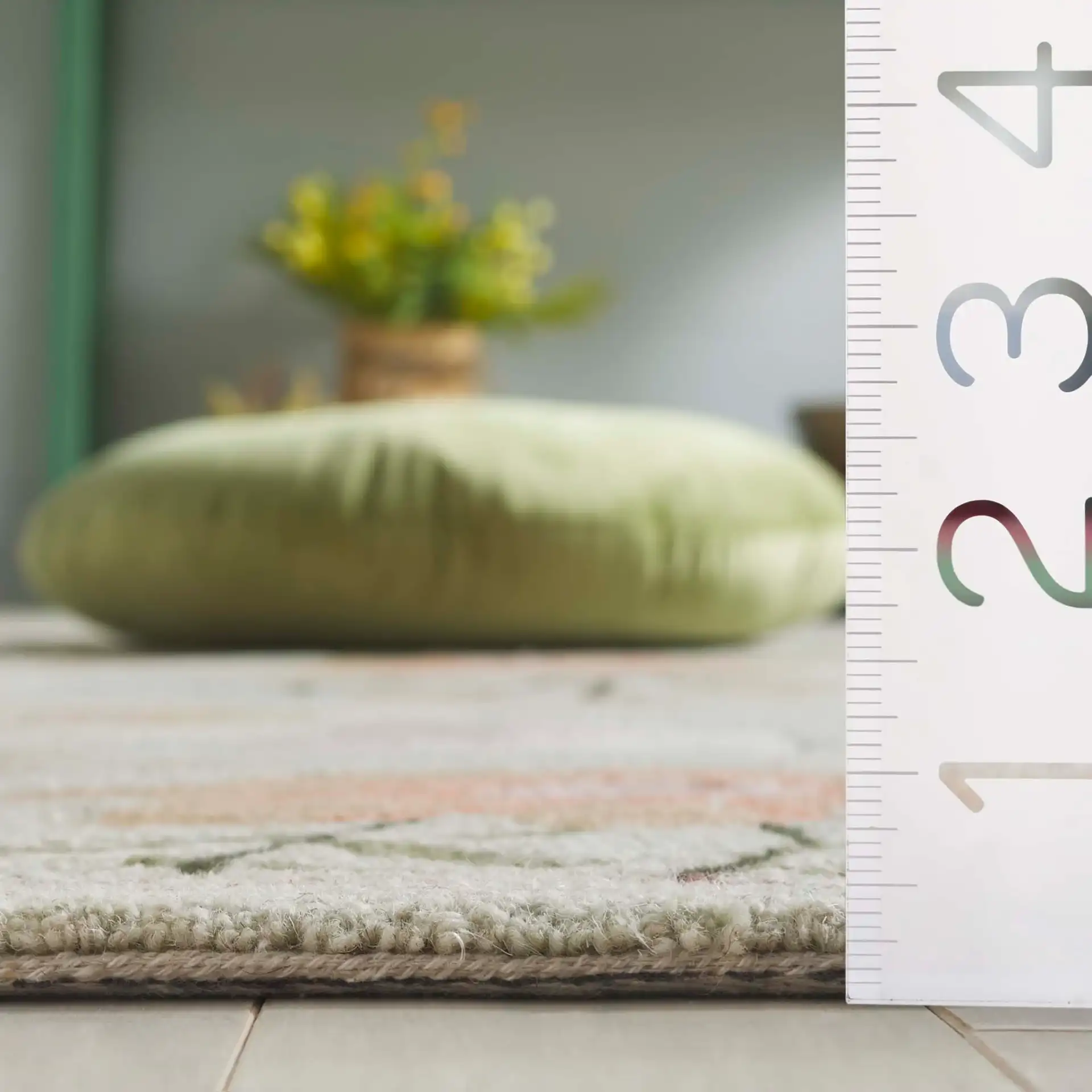 Blossom Floral Sprig Hand-Tufted Wool Rug in Sage / Ivory in a styled room