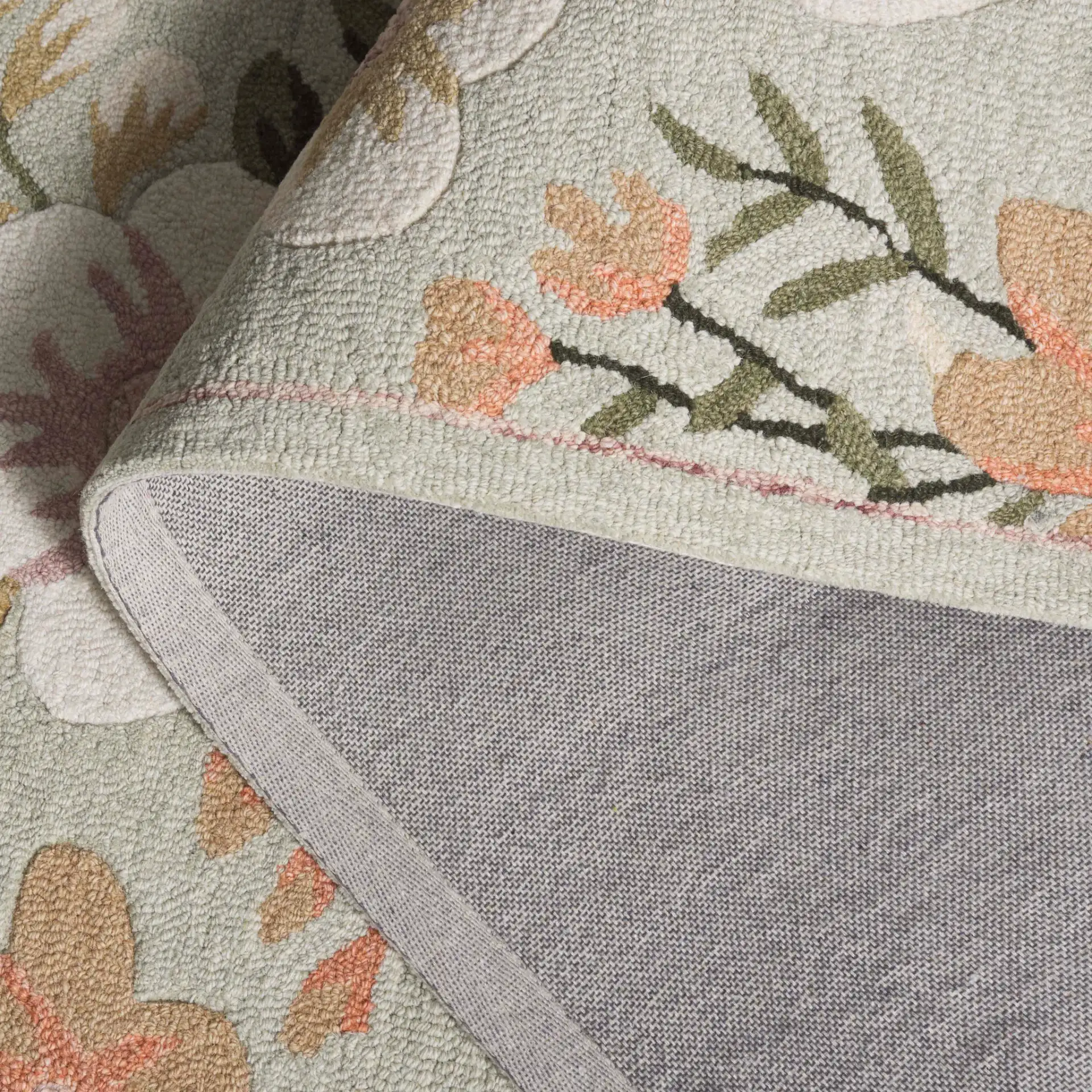 Blossom Floral Sprig Hand-Tufted Wool Rug in Sage / Ivory in a styled room