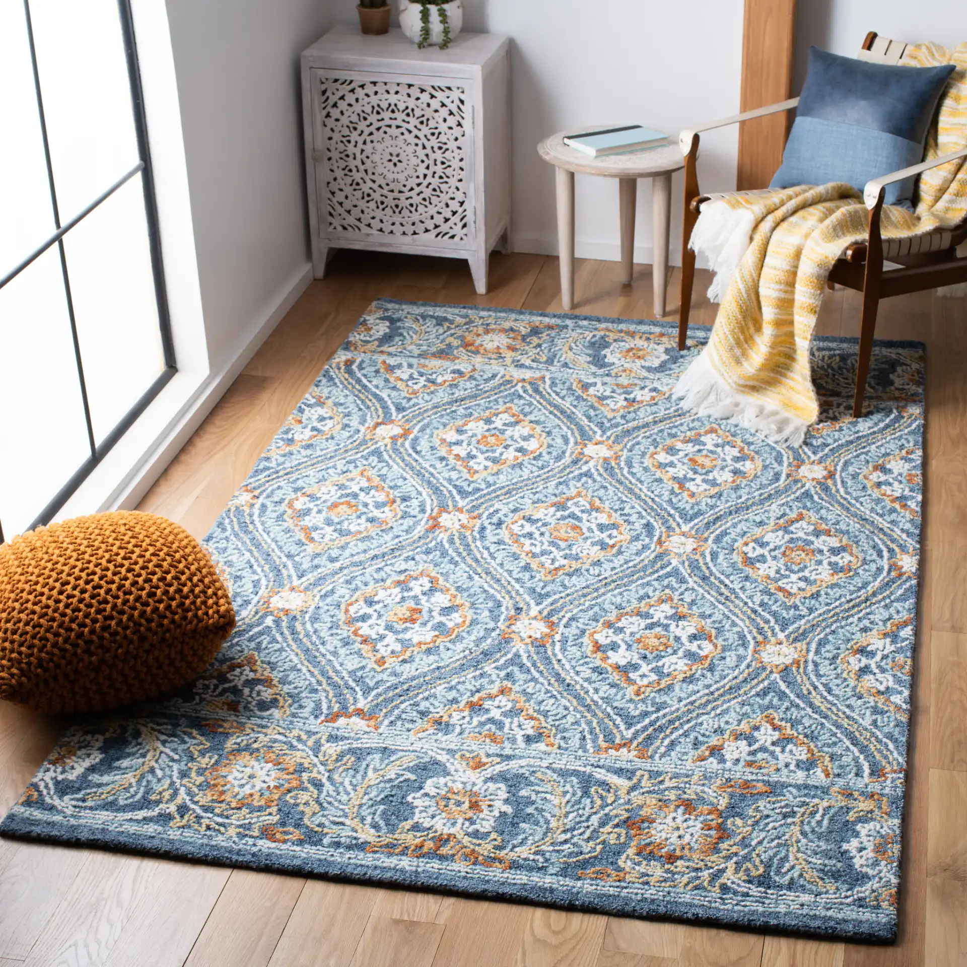 Blossom Floral Ogee Hand-Tufted Wool Rug in Navy / Yellow in a styled room