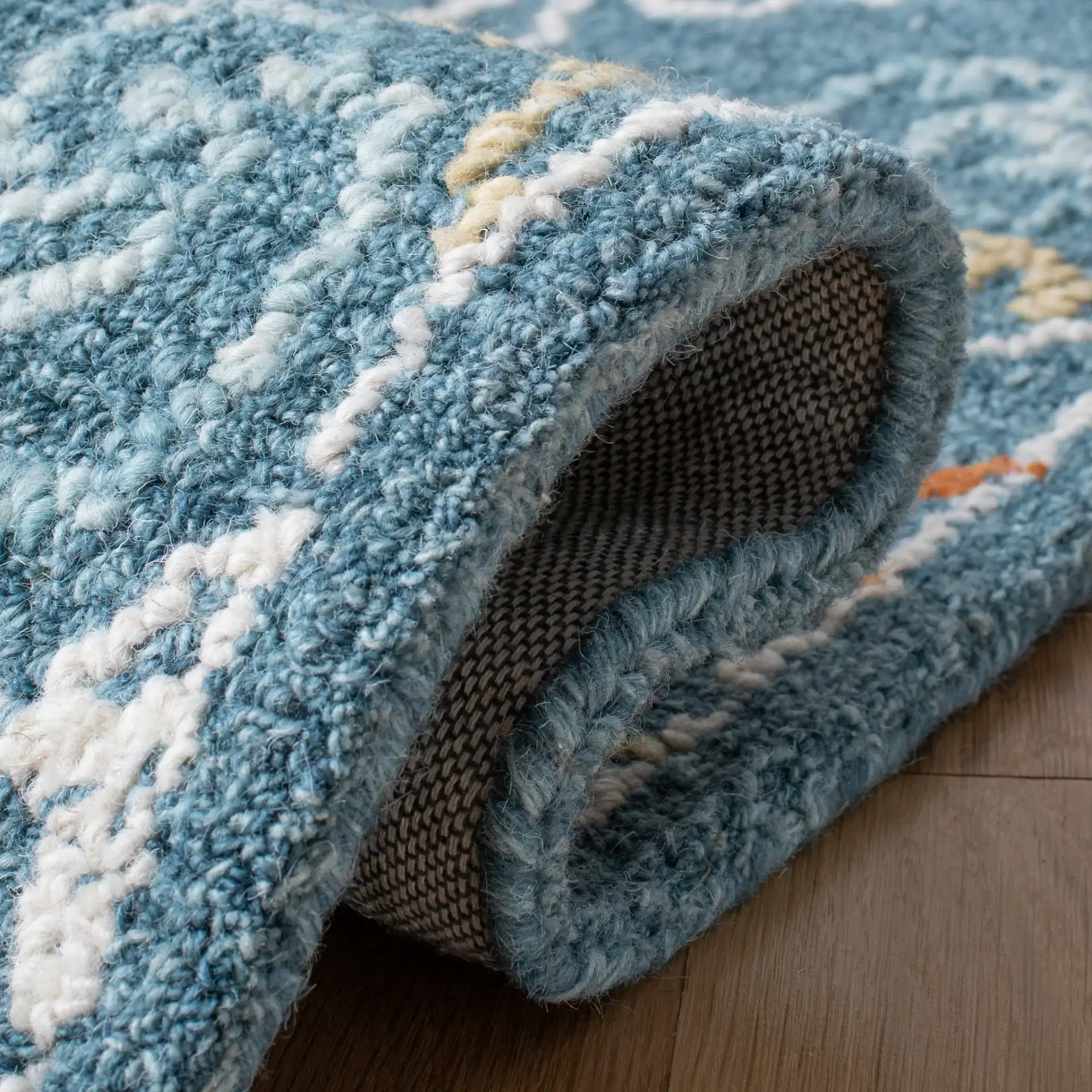 Blossom Damask Diamond Hand-Tufted Wool Rug in Blue / Yellow in a styled room