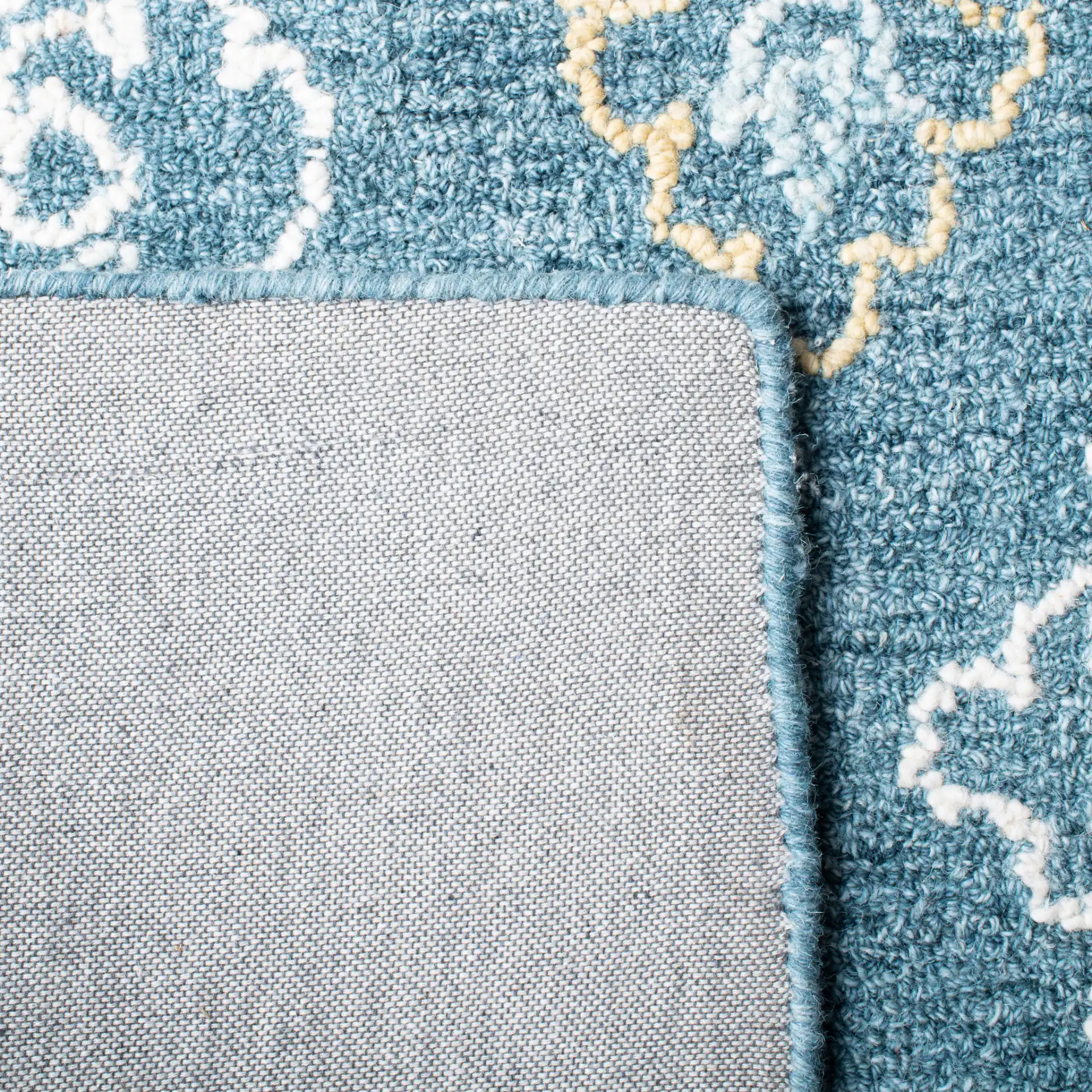 Blossom Damask Diamond Hand-Tufted Wool Rug in Blue / Yellow in a styled room