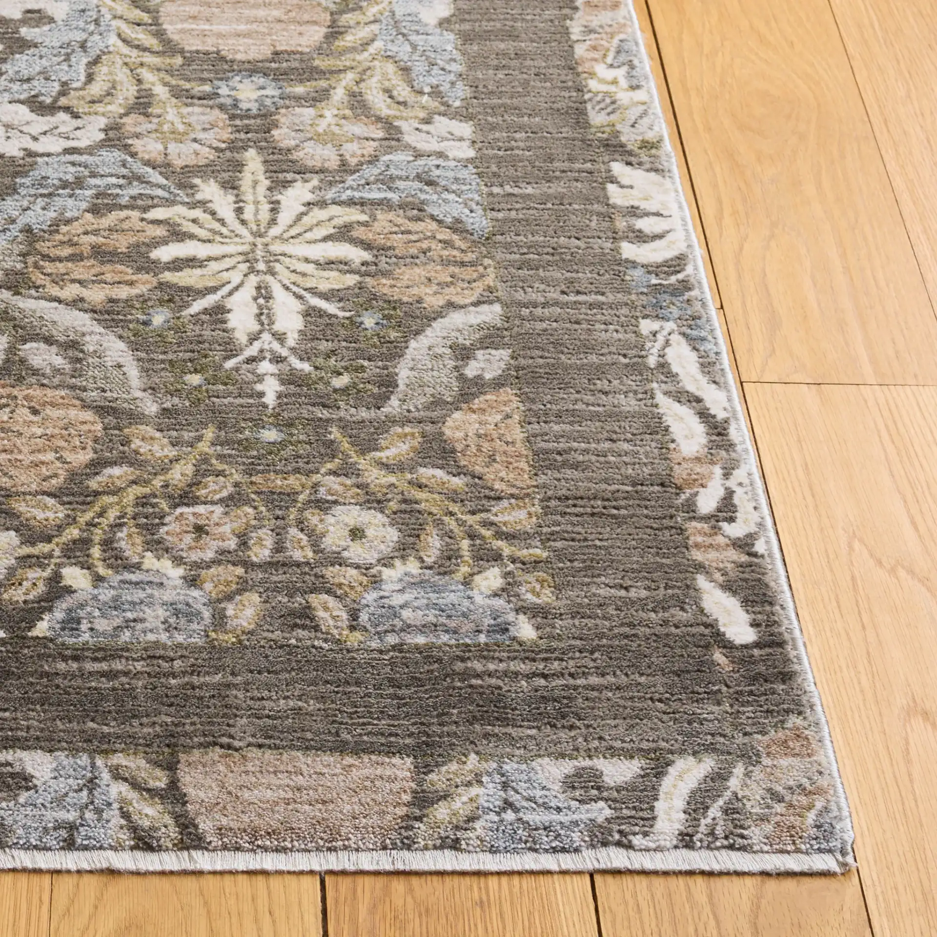 Bloom Damask Floral Rug in Ivory / Gray in a styled room