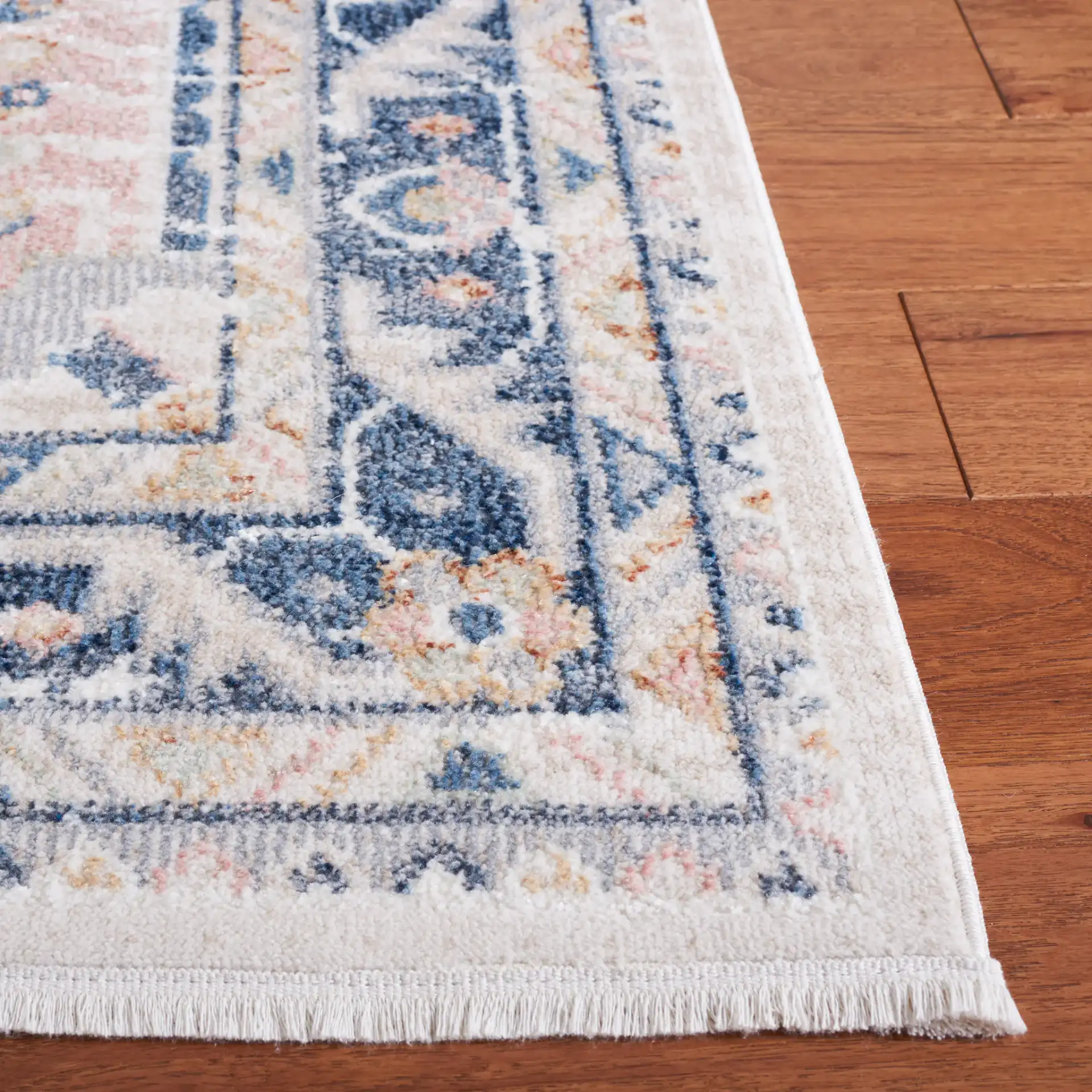 Blair Medallion Border Washable Rug in Beige / Navy in a styled room