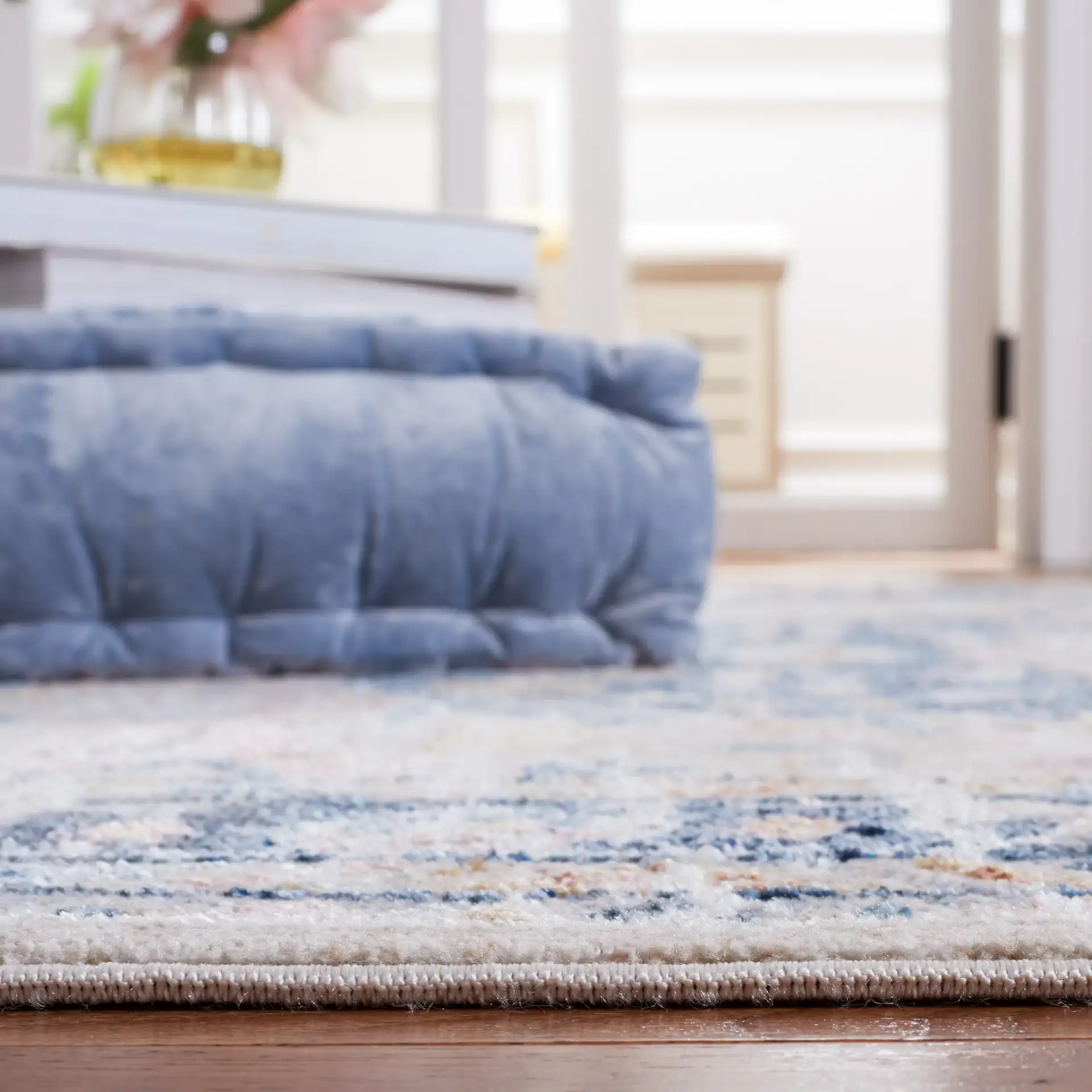 Blair Medallion Border Washable Rug in Beige / Navy in a styled room