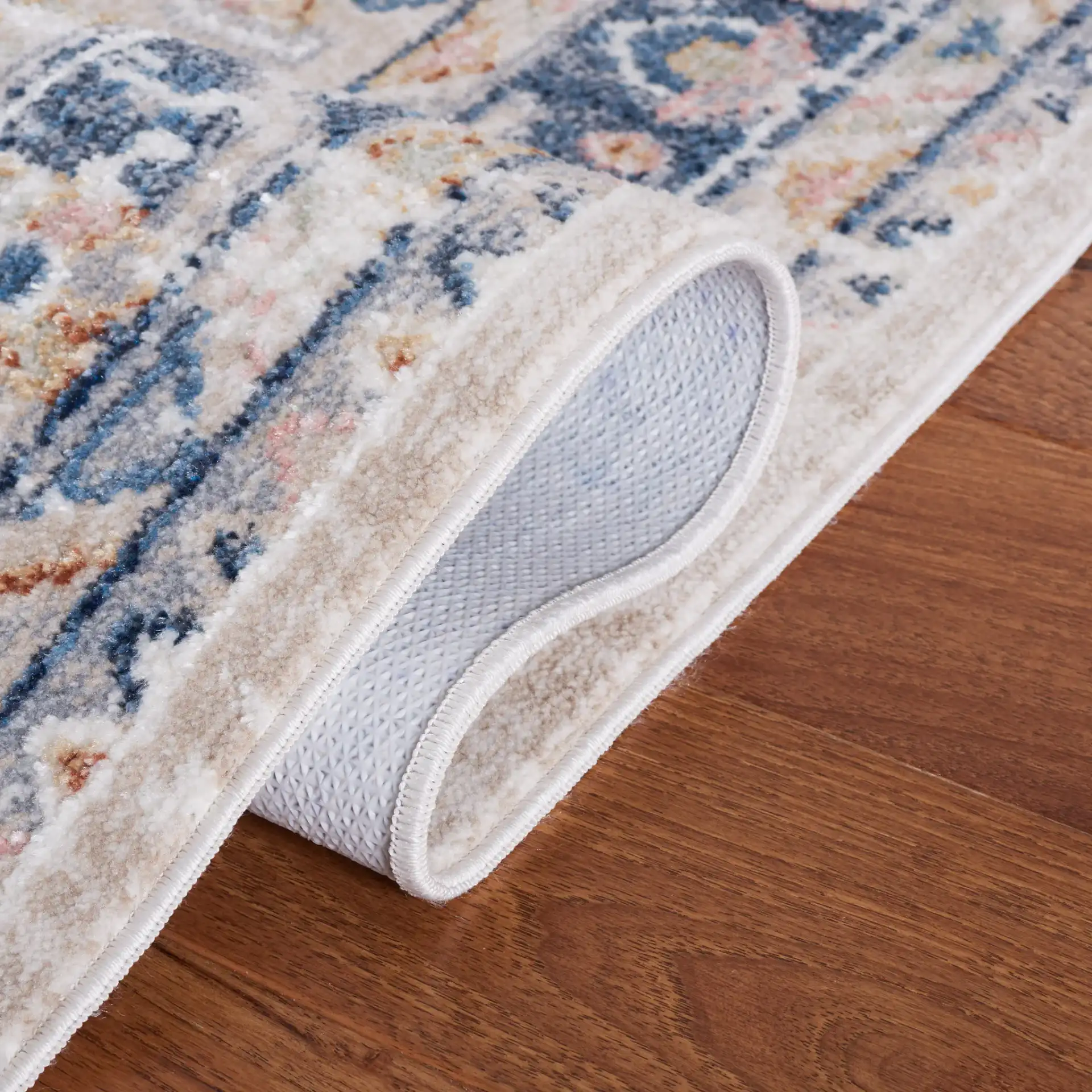 Blair Medallion Border Washable Rug in Beige / Navy in a styled room
