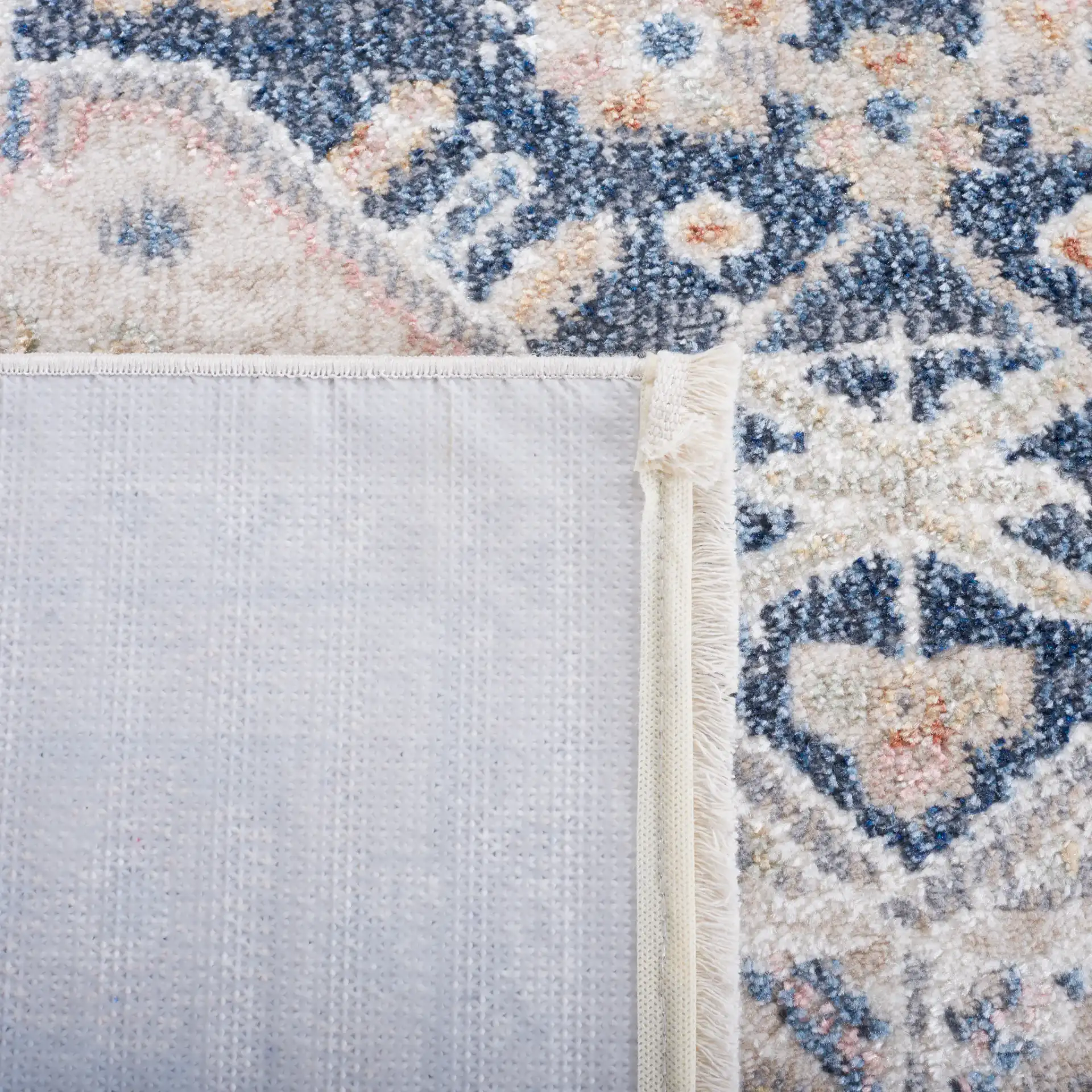 Blair Medallion Border Washable Rug in Beige / Navy in a styled room