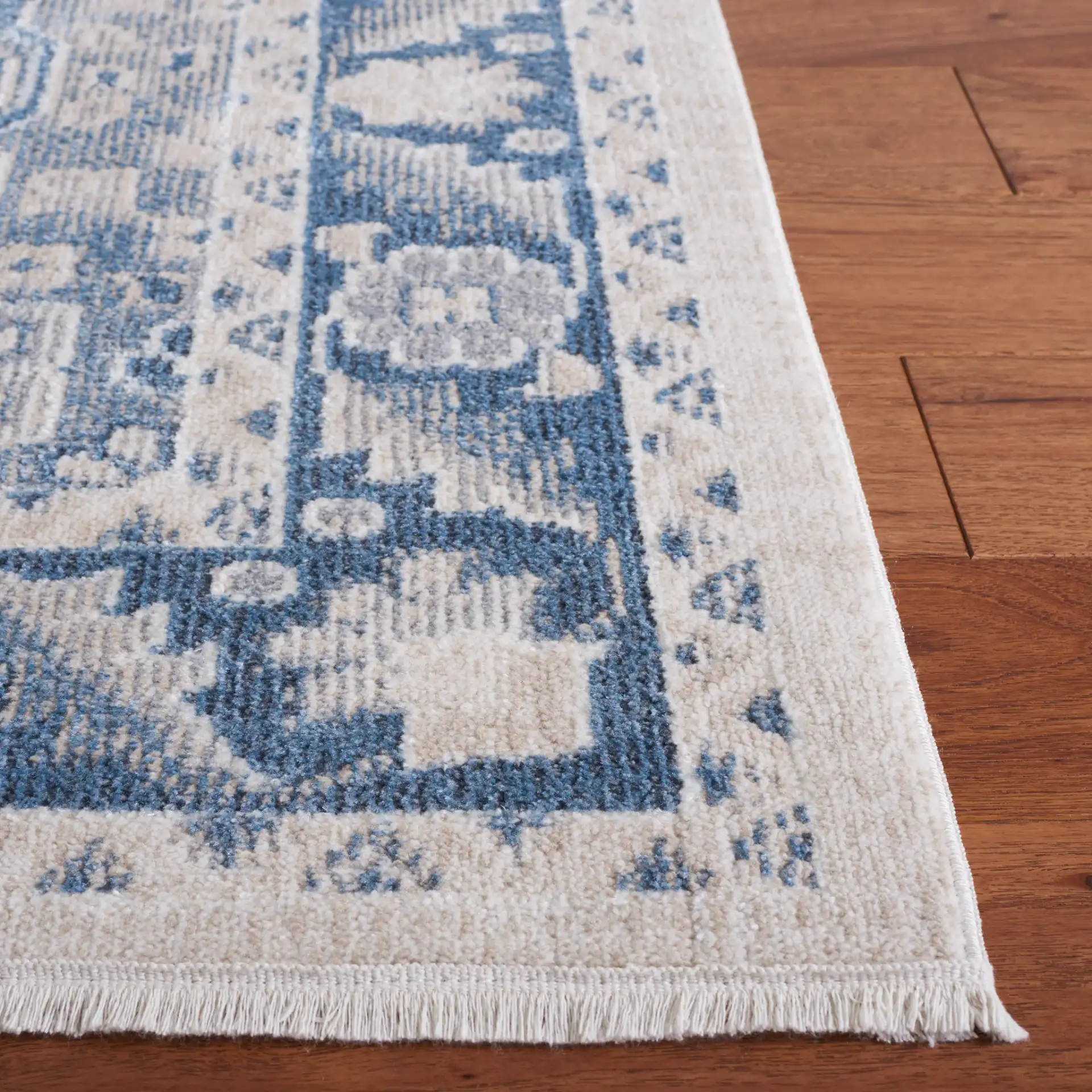 Blair Washable Medallion Bordered Rug in Beige / Gray Blue in a styled room