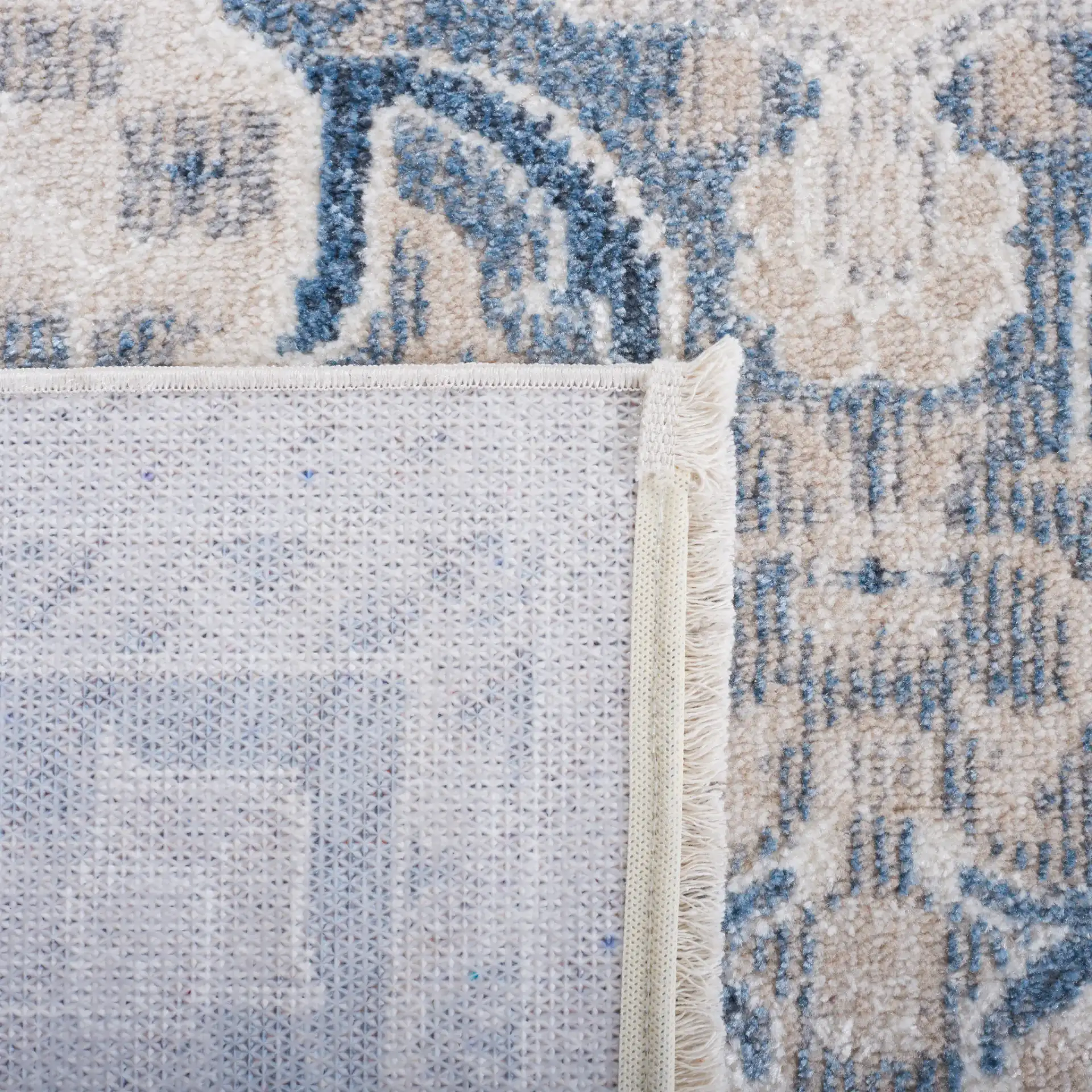 Blair Washable Medallion Bordered Rug in Beige / Gray Blue in a styled room