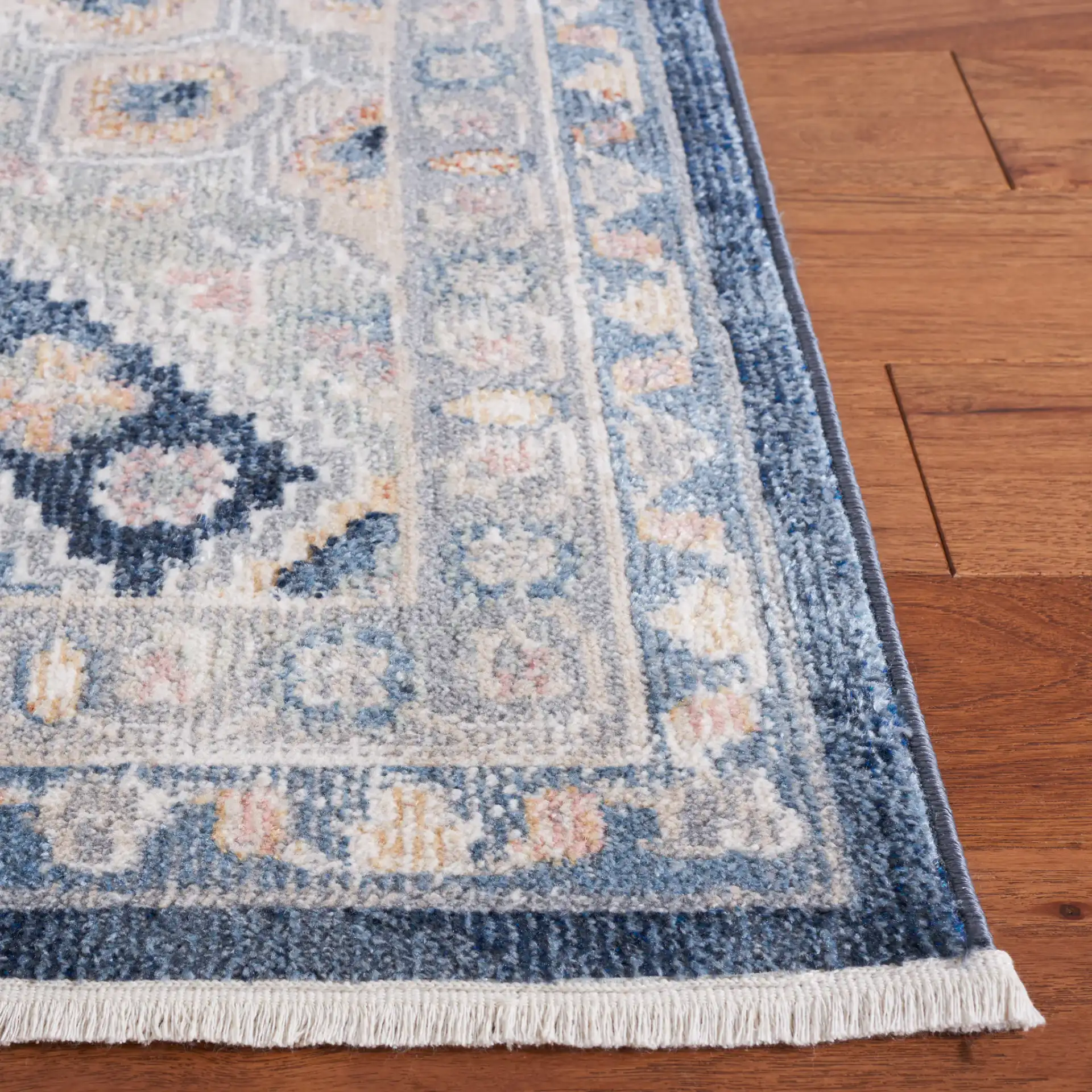 Blair Geometric Diamond Medallion Washable Rug in Gray / Navy in a styled room