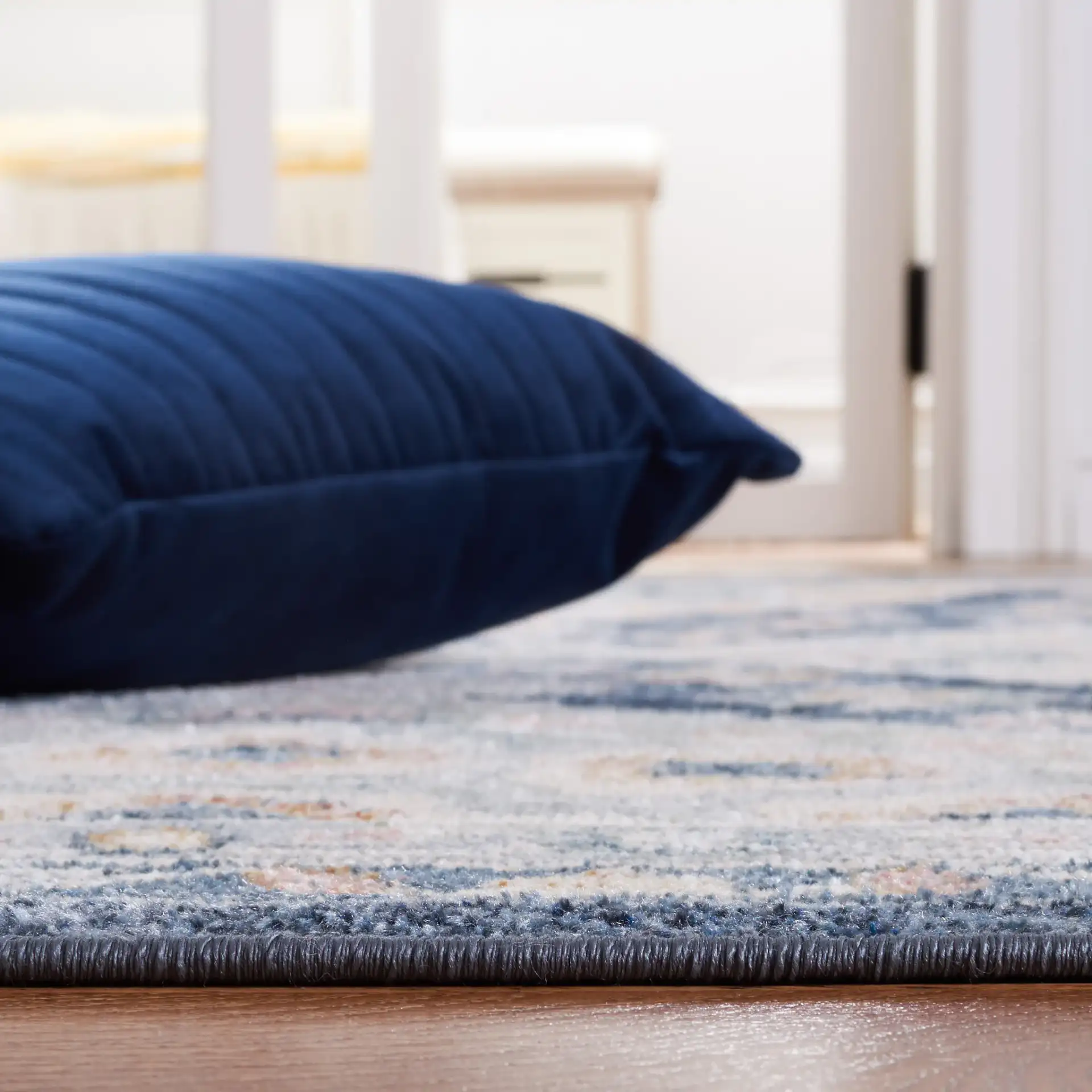 Blair Geometric Diamond Medallion Washable Rug in Gray / Navy in a styled room