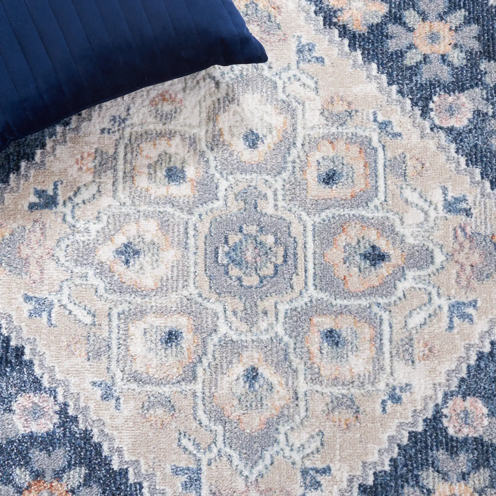 Blair Geometric Diamond Medallion Washable Rug in Gray / Navy in a styled room