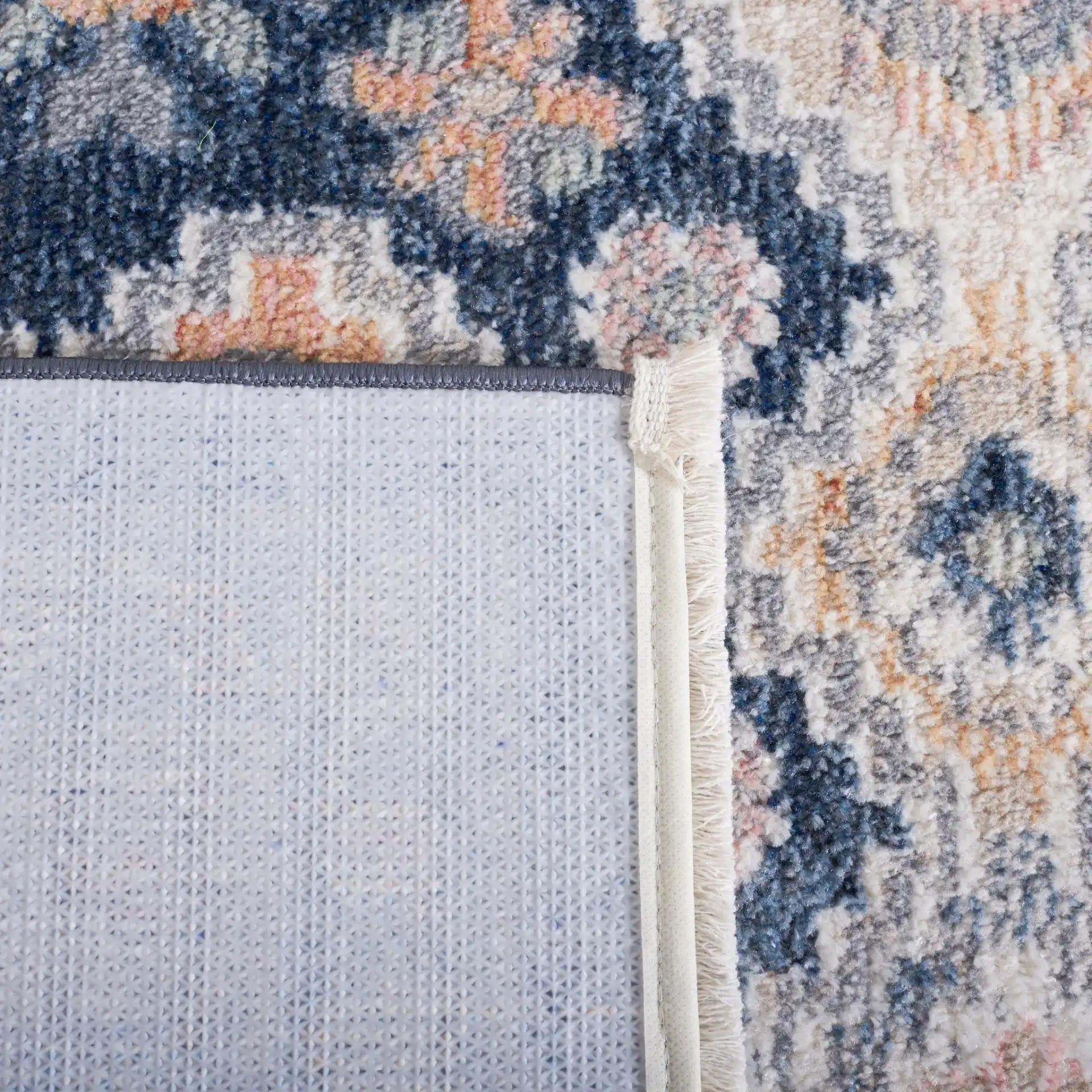 Blair Geometric Diamond Medallion Washable Rug in Gray / Navy in a styled room