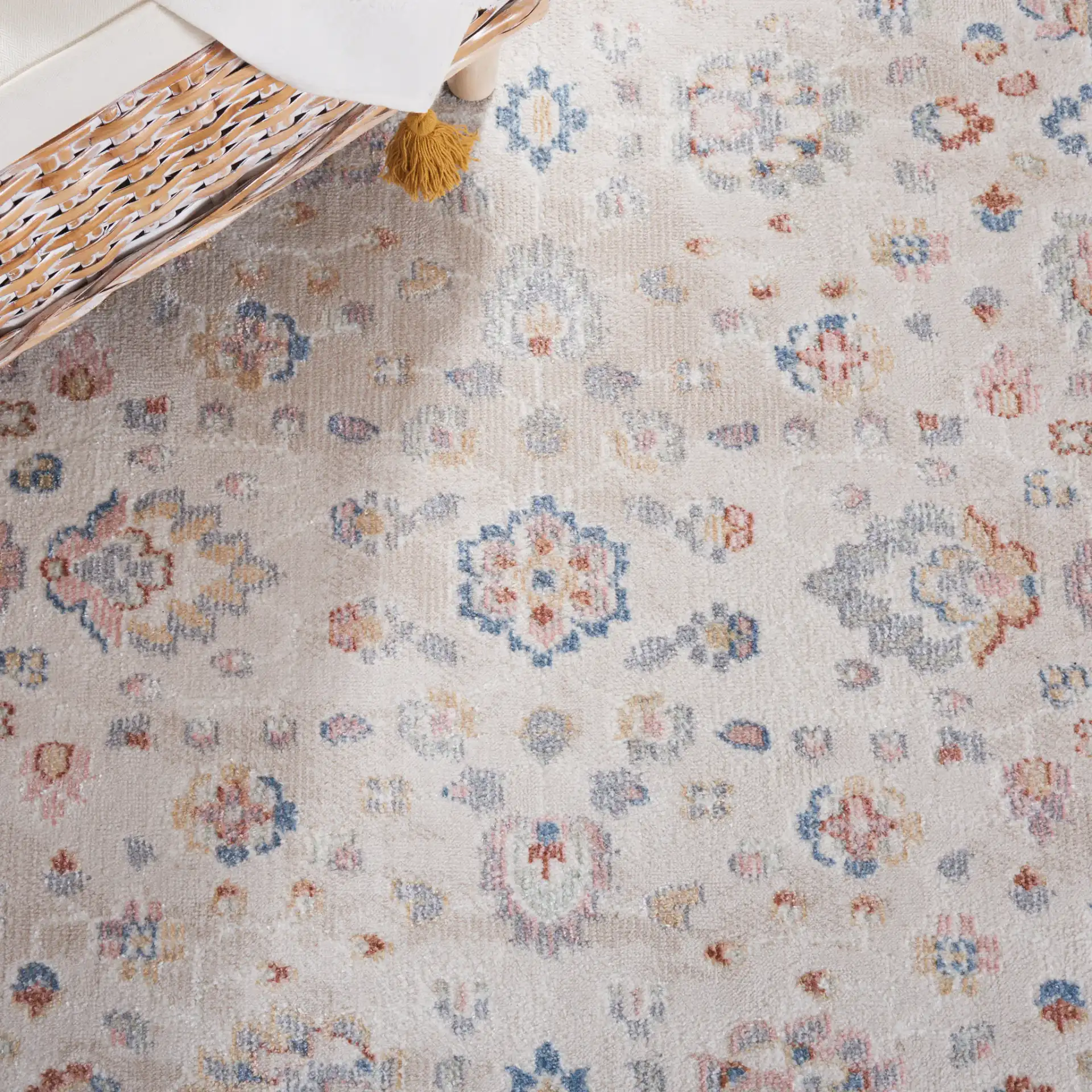 Blair Floral Bordered Washable Rug in Beige / Gray in a styled room