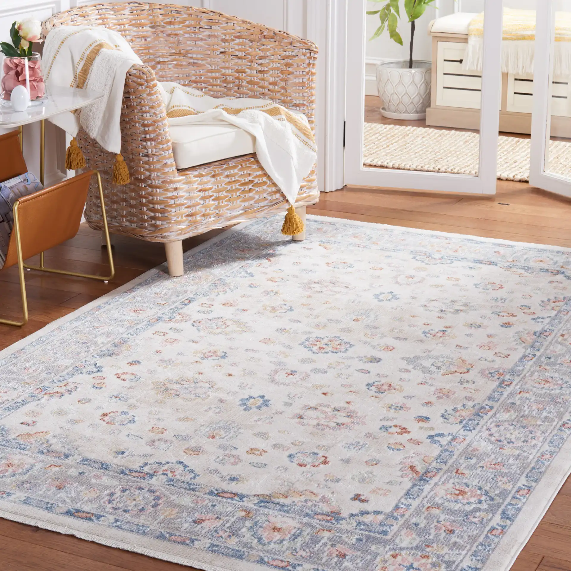 Blair Floral Bordered Washable Rug in Beige / Gray in a styled room