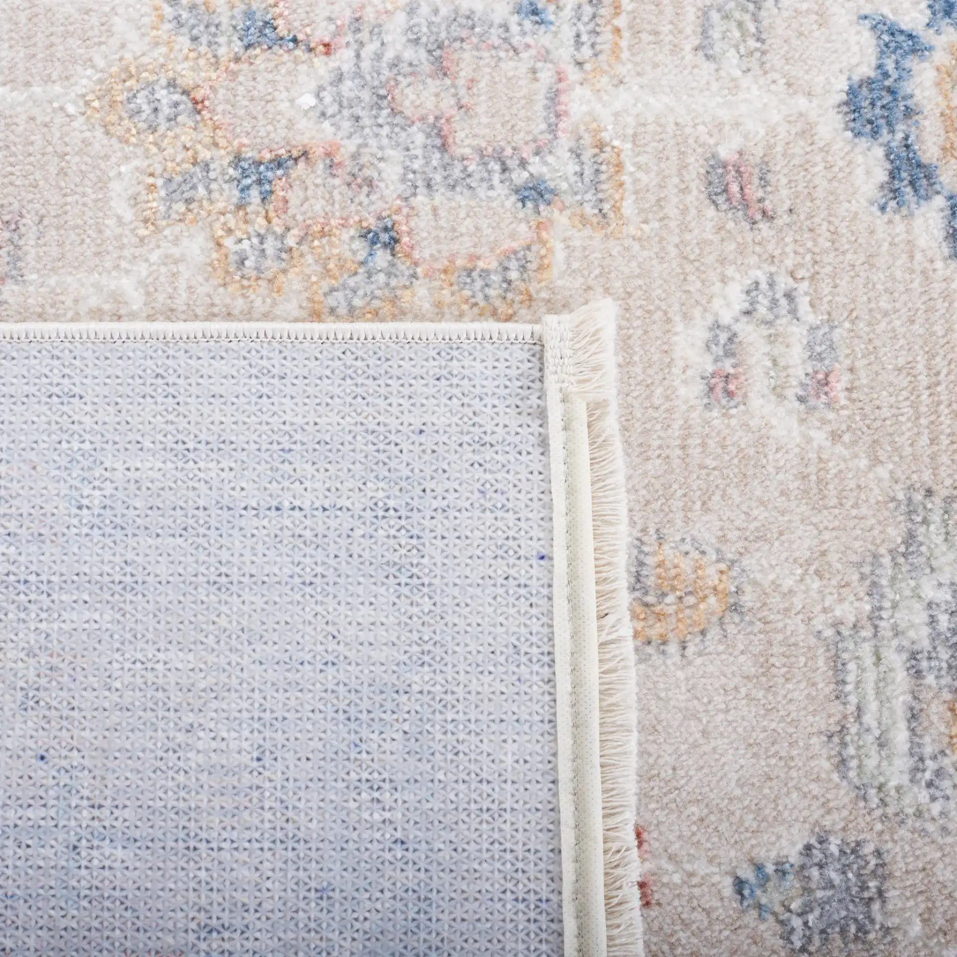 Blair Floral Bordered Washable Rug in Beige / Gray in a styled room