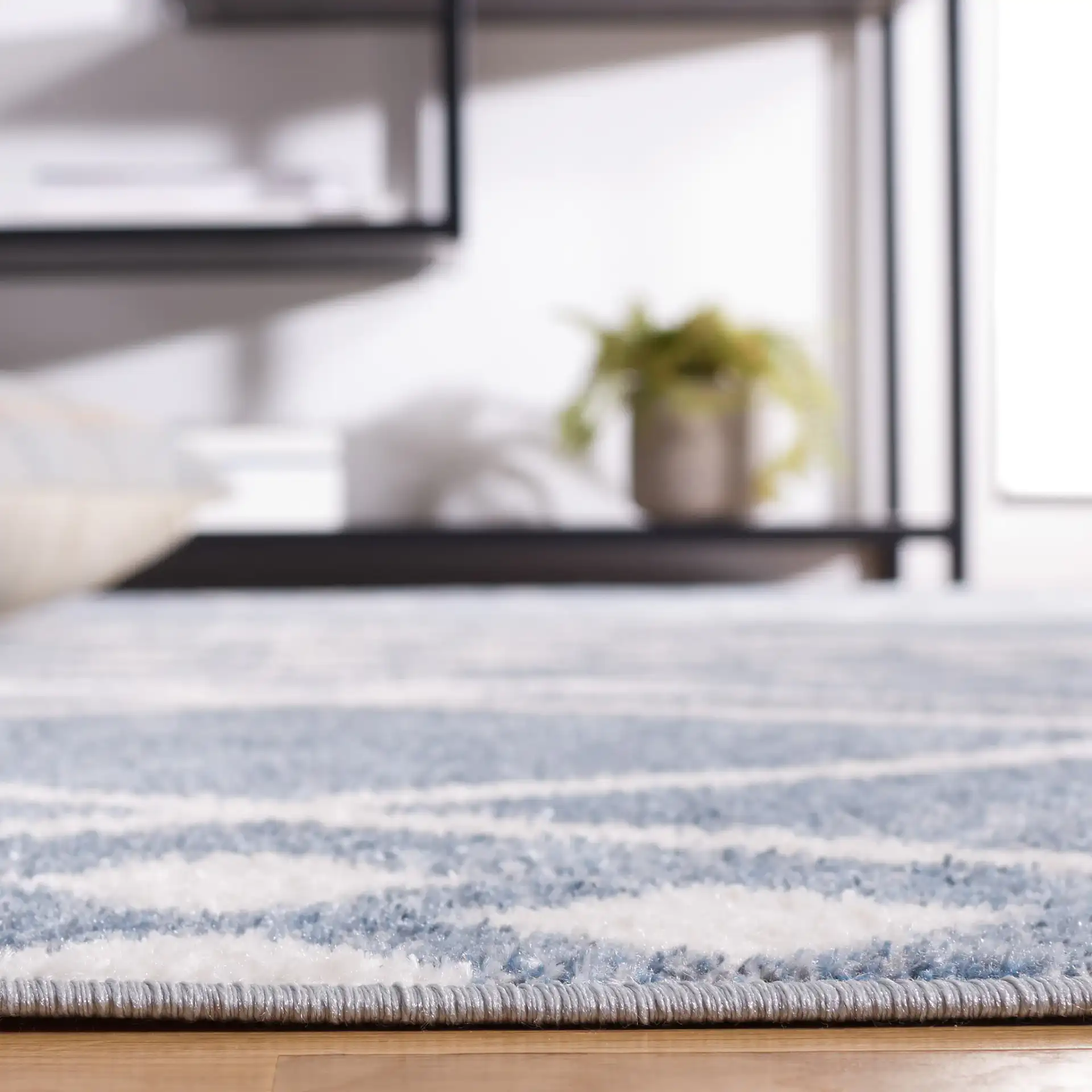 Blair Diamond Lattice Washable Rug in Blue / Ivory in a styled room