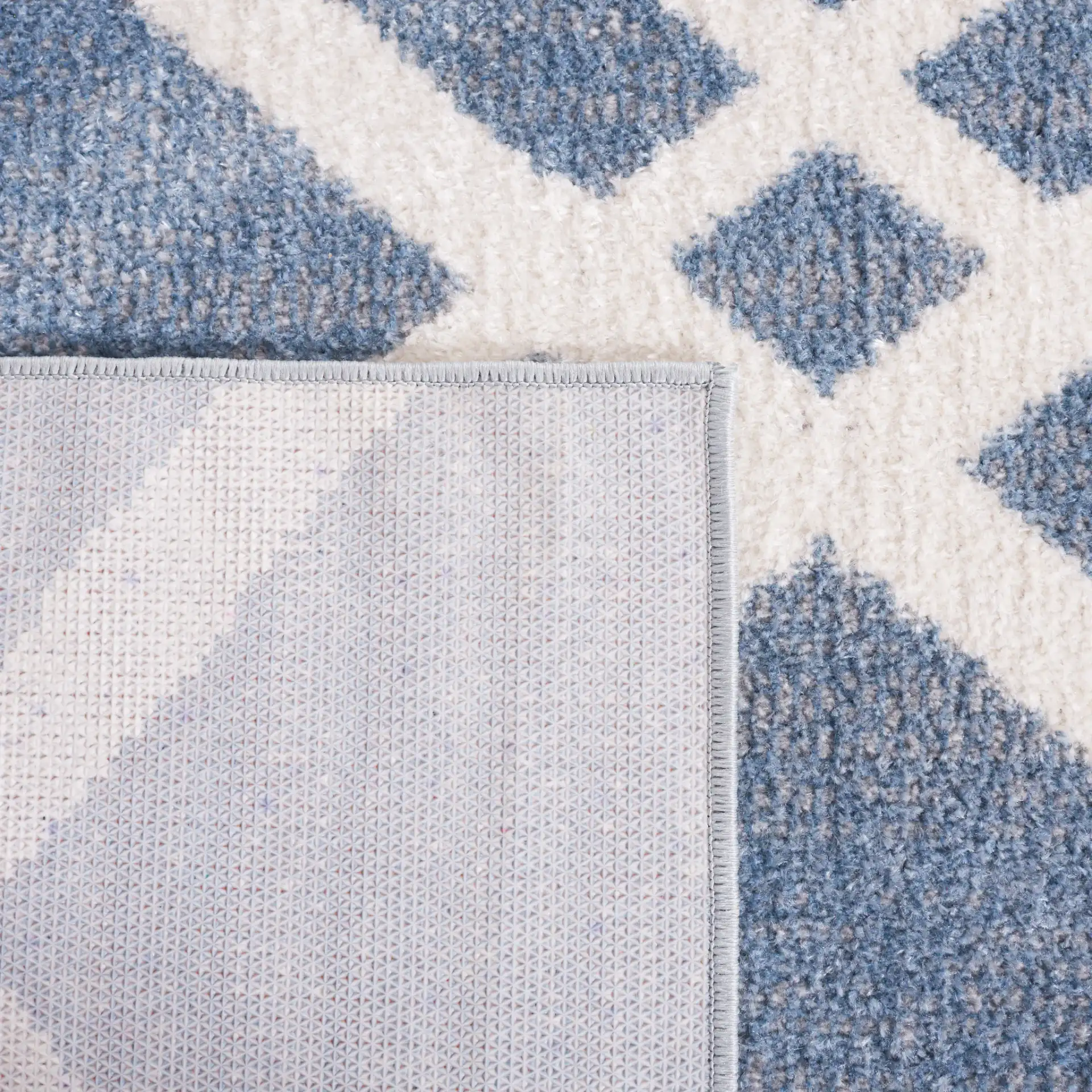 Blair Diamond Lattice Washable Rug in Blue / Ivory in a styled room