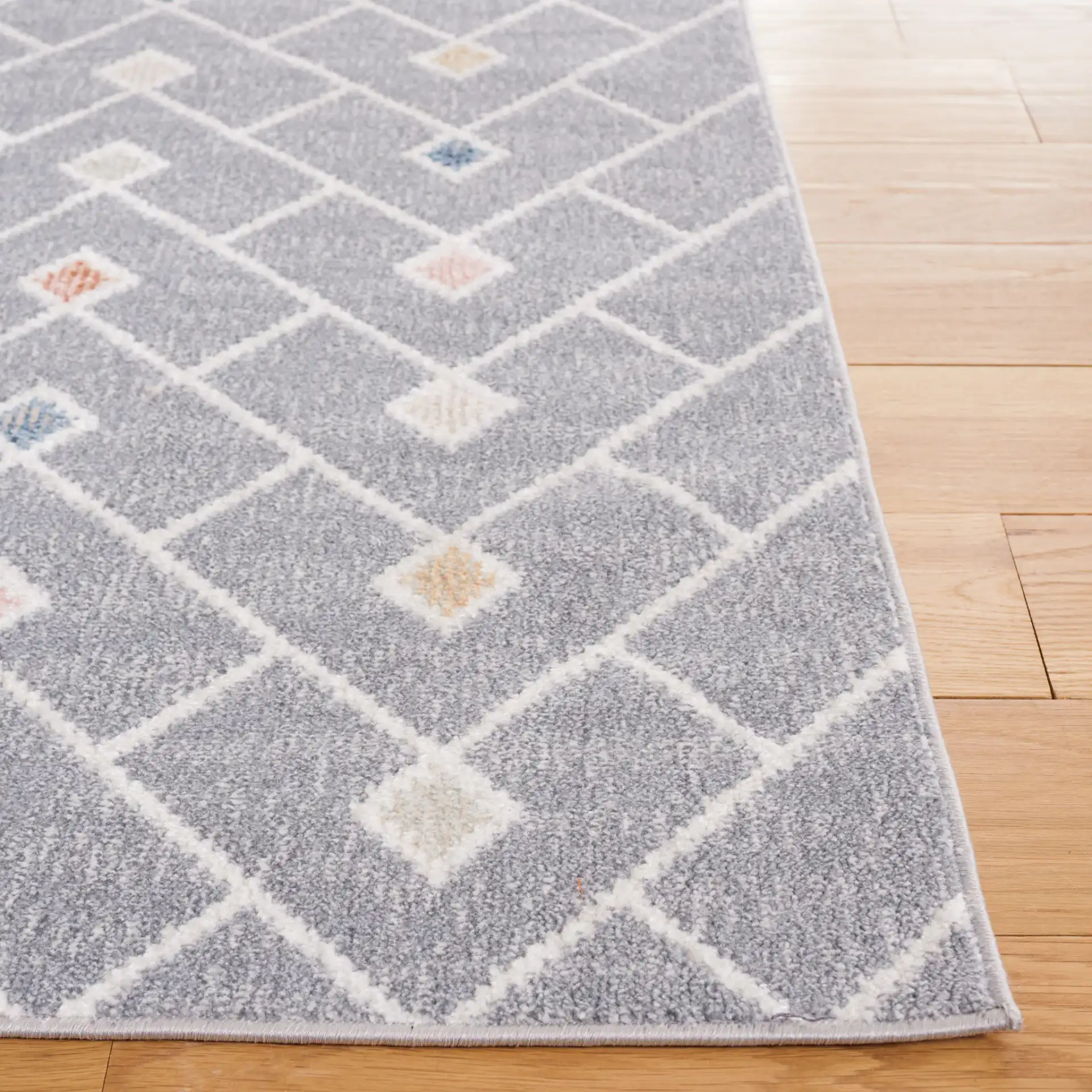 Blair Chevron Lattice Washable Rug in Gray / Multicolor in a styled room