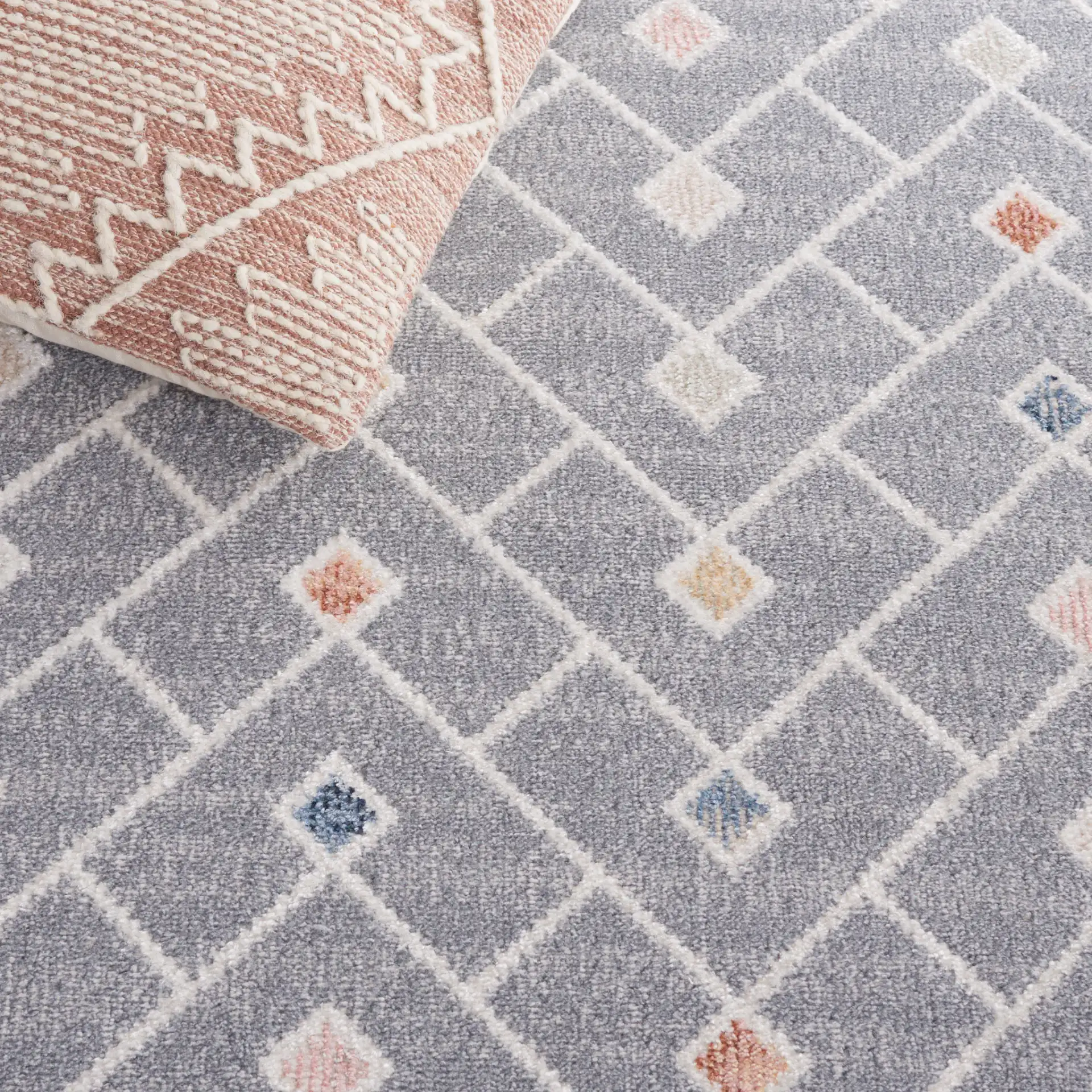 Blair Chevron Lattice Washable Rug in Gray / Multicolor in a styled room