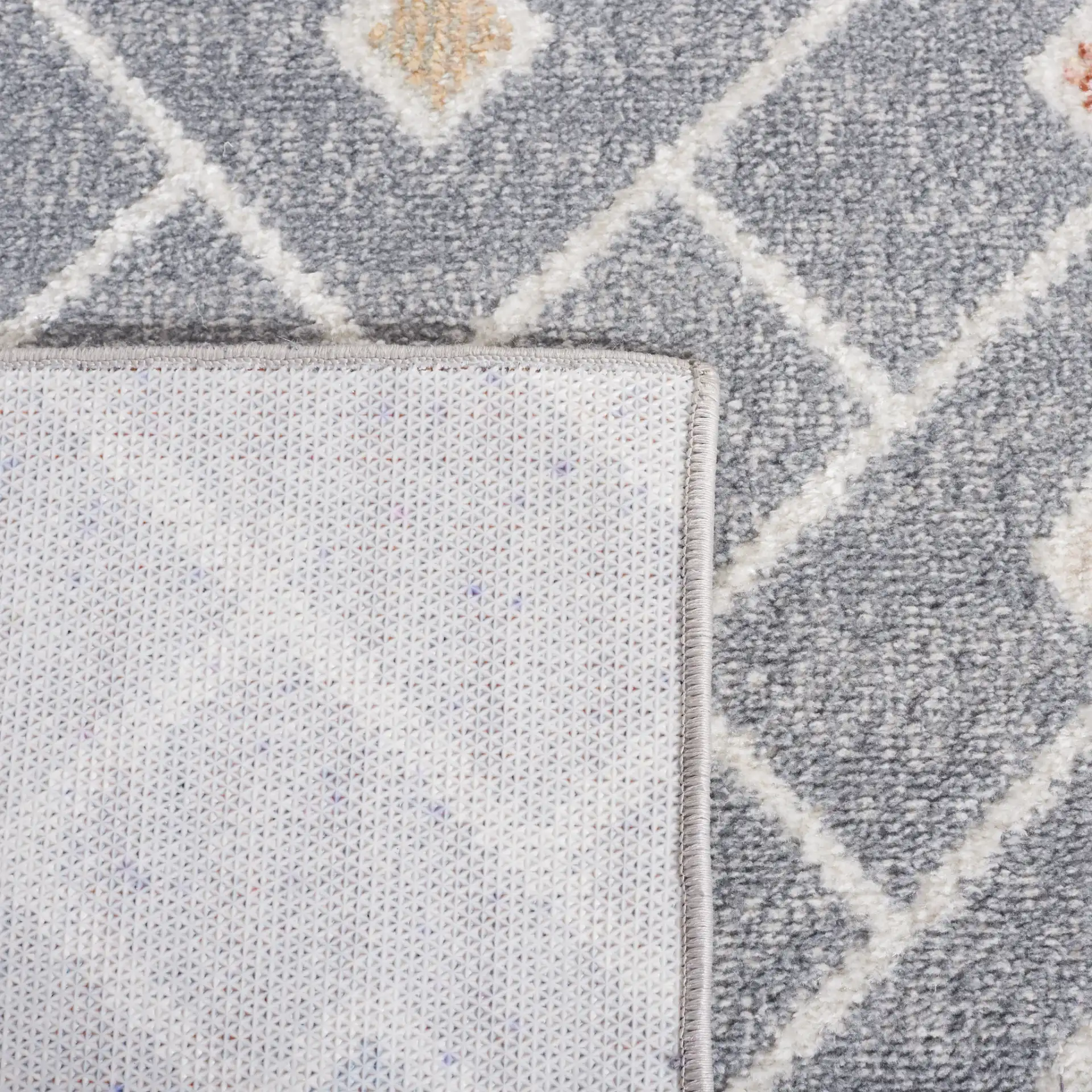 Blair Chevron Lattice Washable Rug in Gray / Multicolor in a styled room