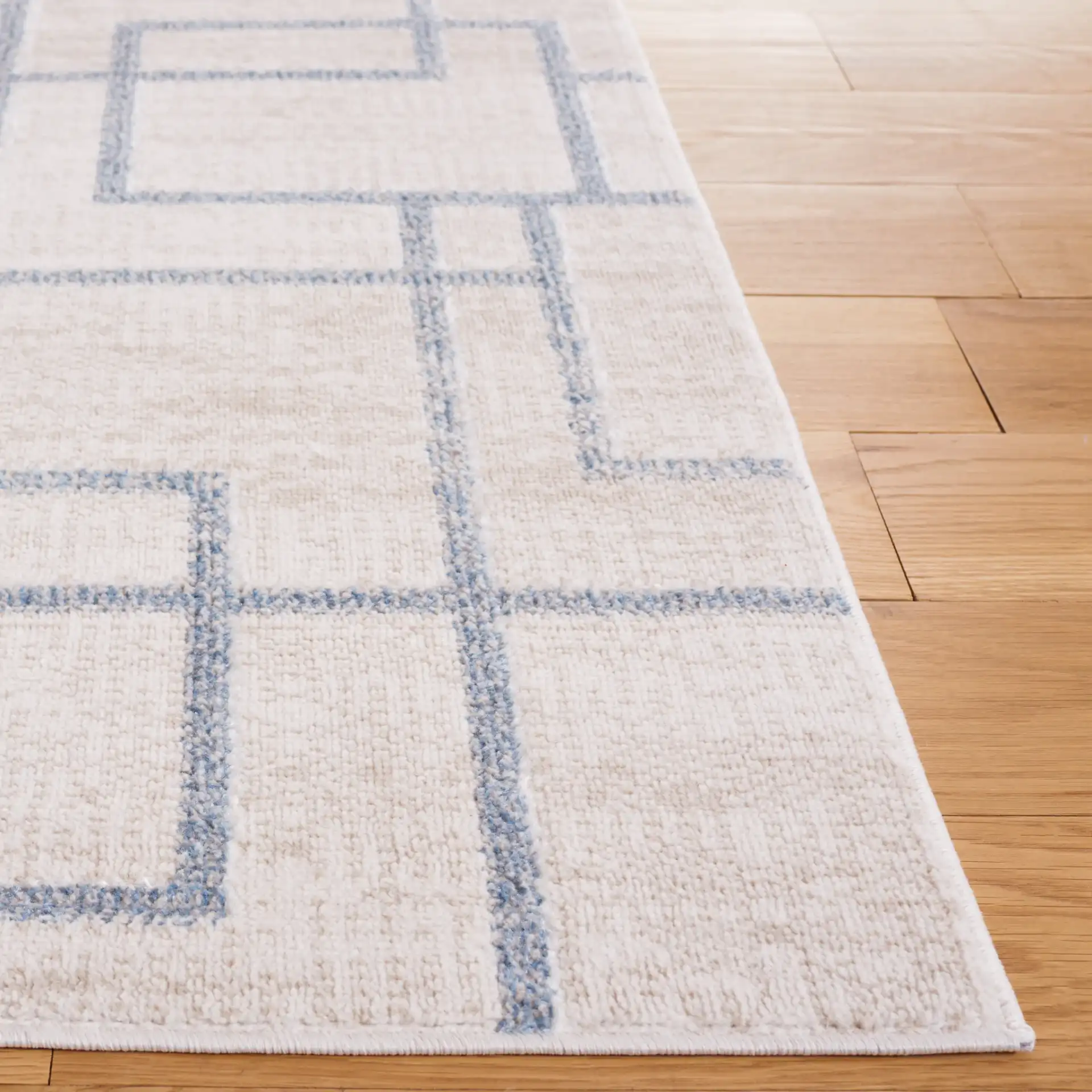 Blair Washable Intersecting Square Rug in Beige / Gray in a styled room