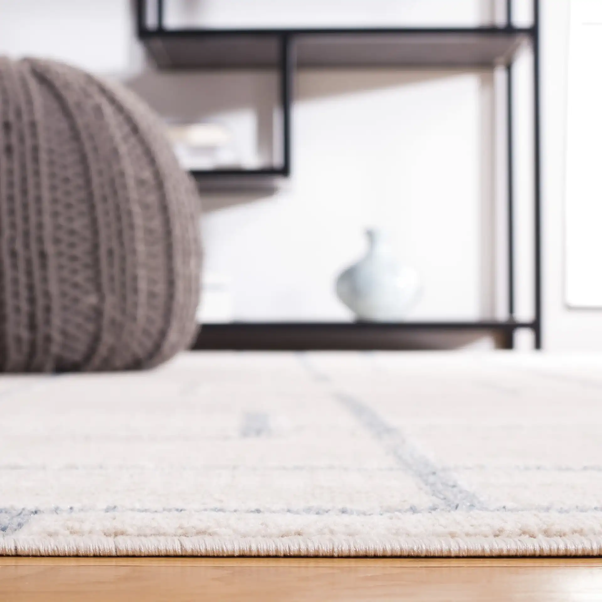 Blair Washable Intersecting Square Rug in Beige / Gray in a styled room