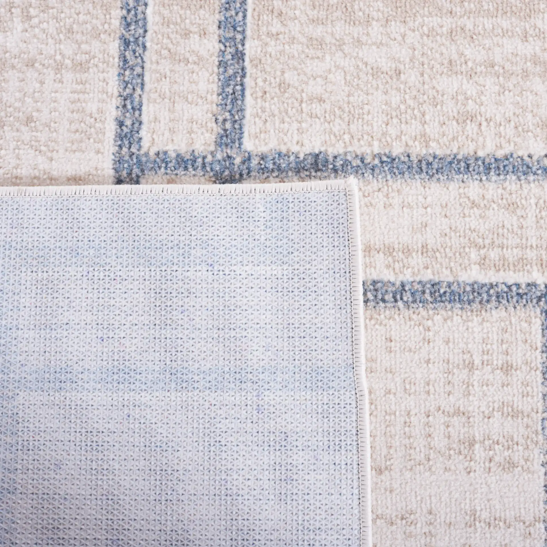 Blair Washable Intersecting Square Rug in Beige / Gray in a styled room