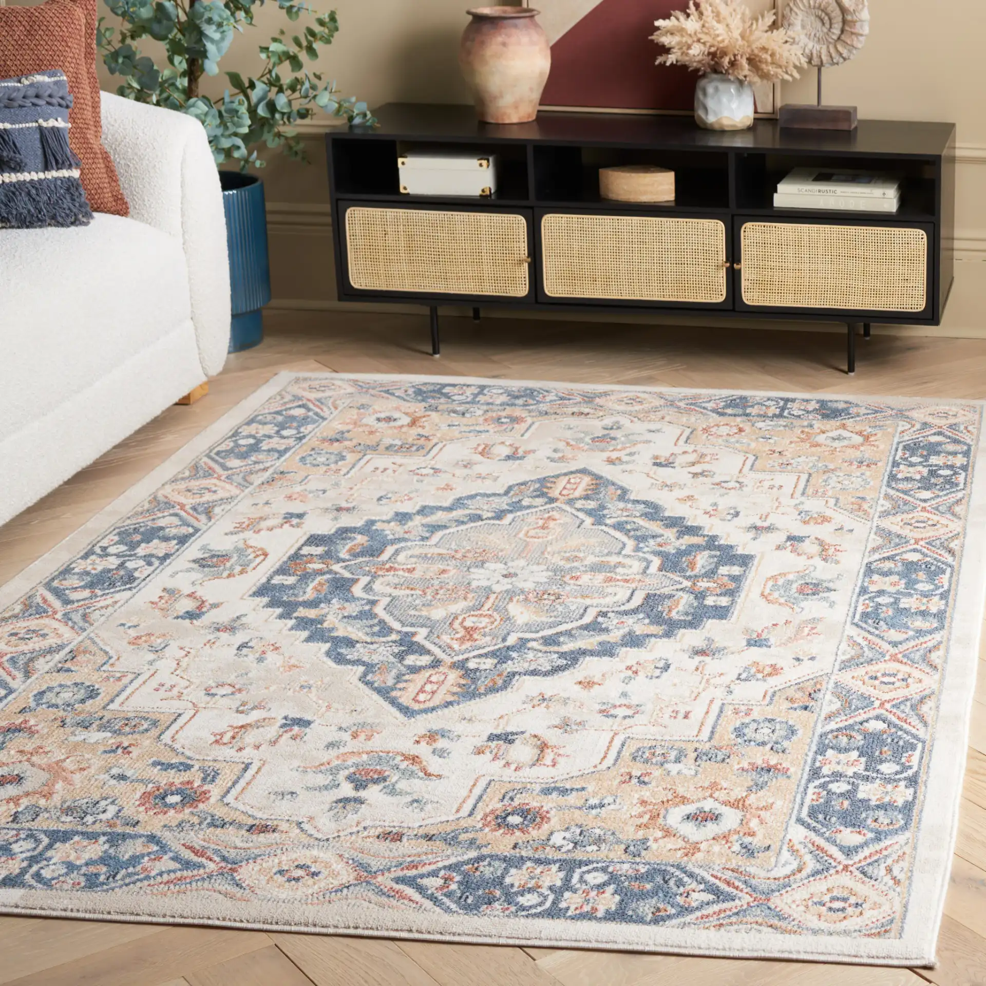Blair Tribal Medallion Washable Rug in Ivory / Blue in a styled room
