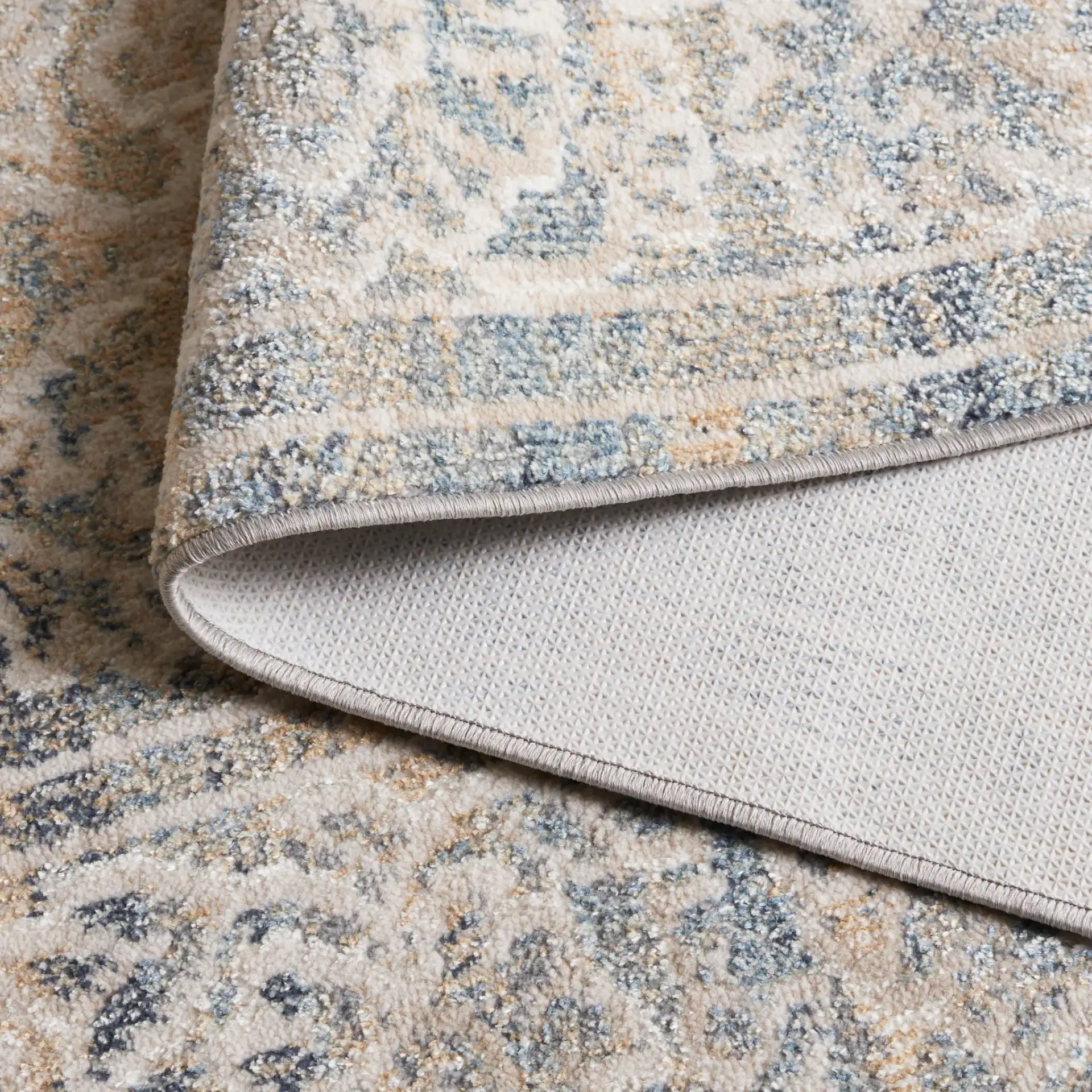 Blair Bordered Floral Washable Rug in Ivory / Blue in a styled room