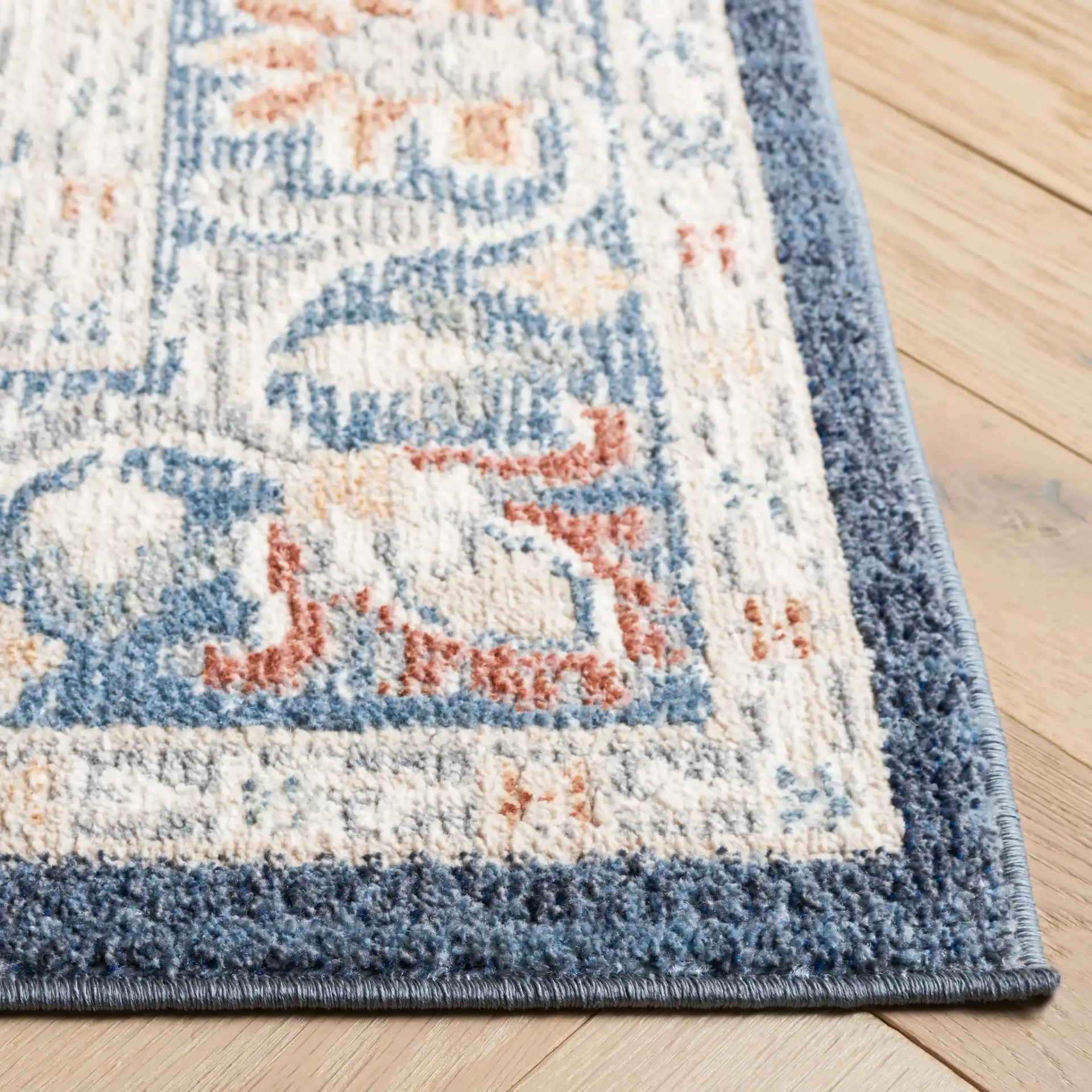 Blair Floral Medallion Washable Rug in Navy / Blue in a styled room