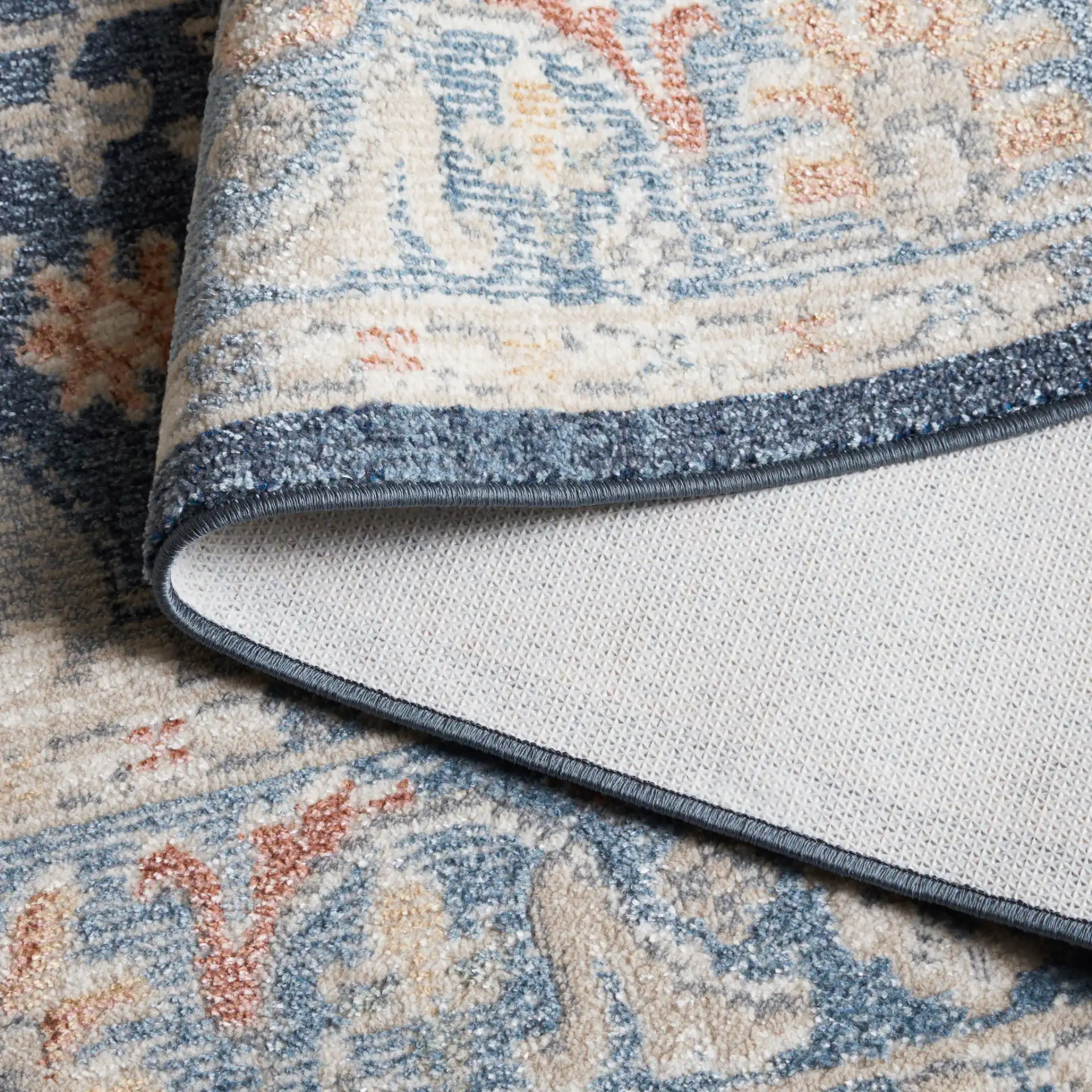 Blair Floral Medallion Washable Rug in Navy / Blue in a styled room