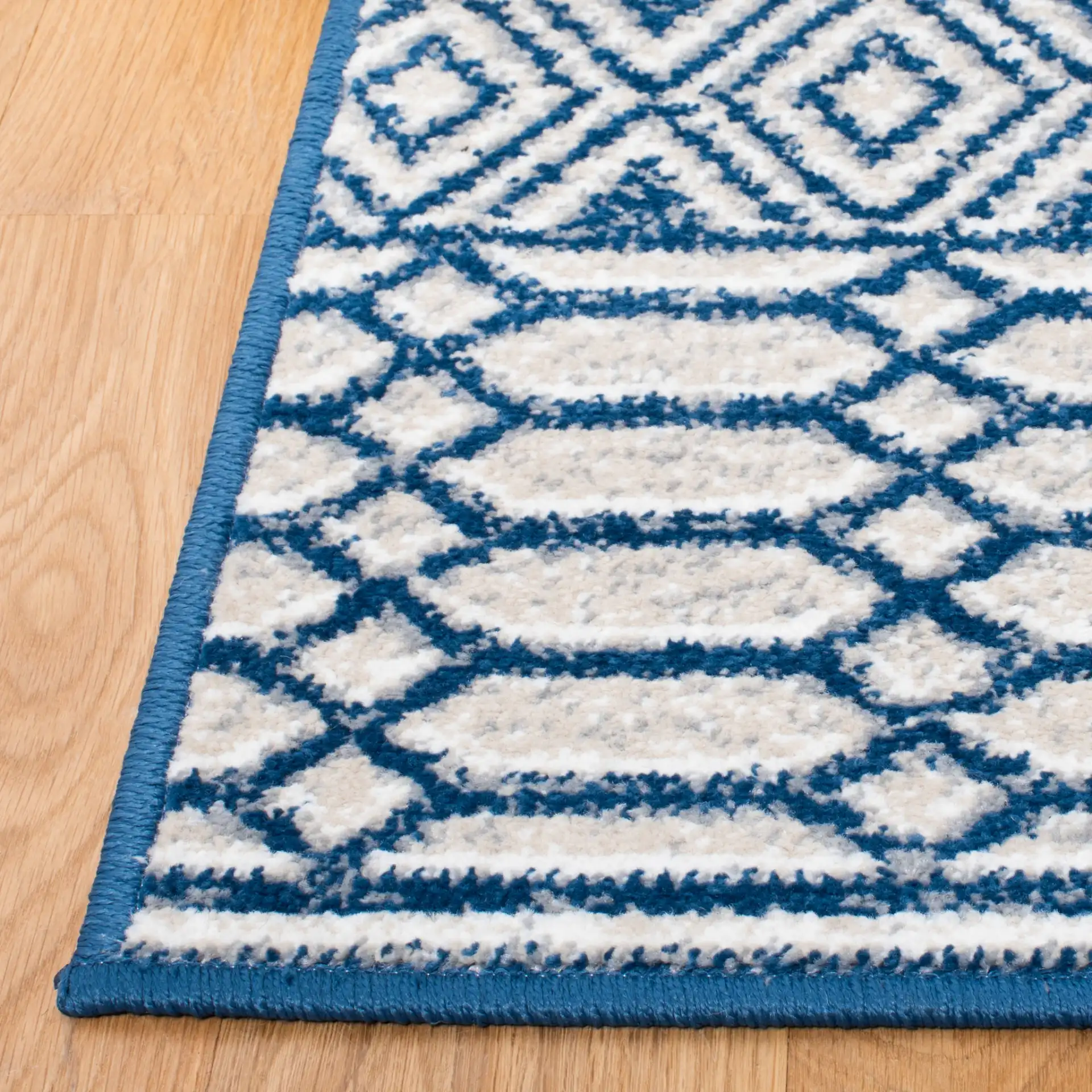 Belmont Banded Diamond Rug in Navy / Gray in a styled room