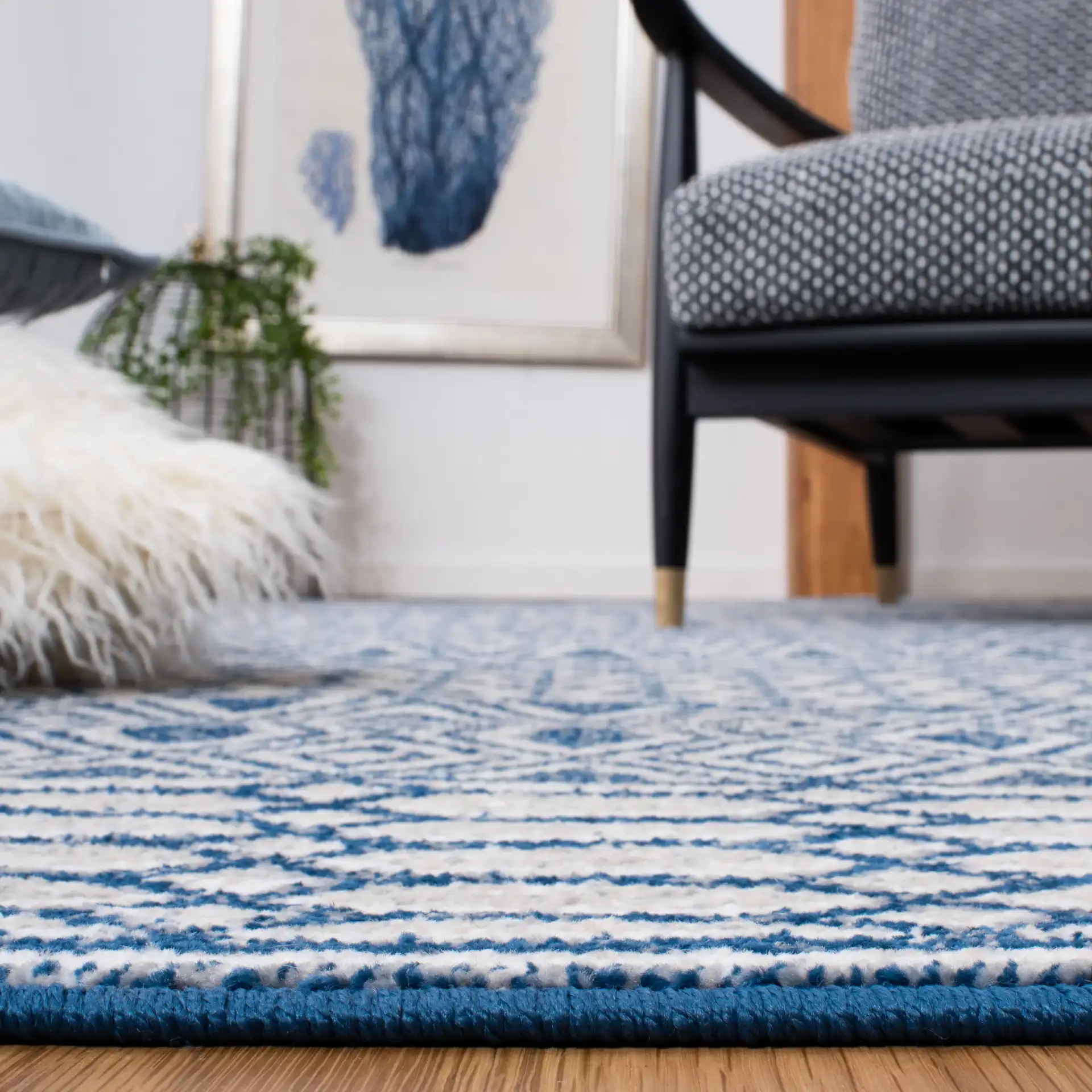 Belmont Banded Diamond Rug in Navy / Gray in a styled room