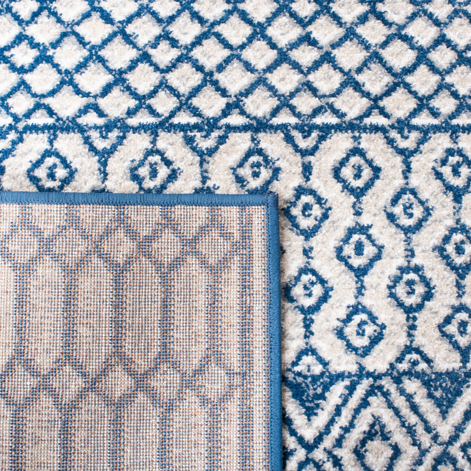 Belmont Banded Diamond Rug in Navy / Gray in a styled room