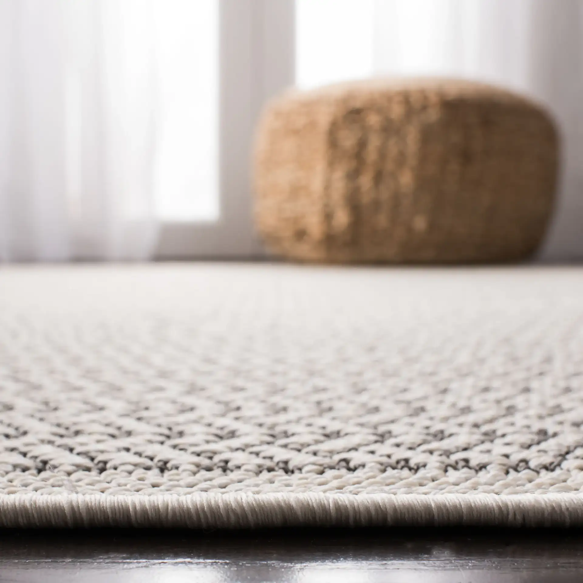 Bermuda Diamond Lattice Washable Outdoor Rug in Cream / Gray in a styled room