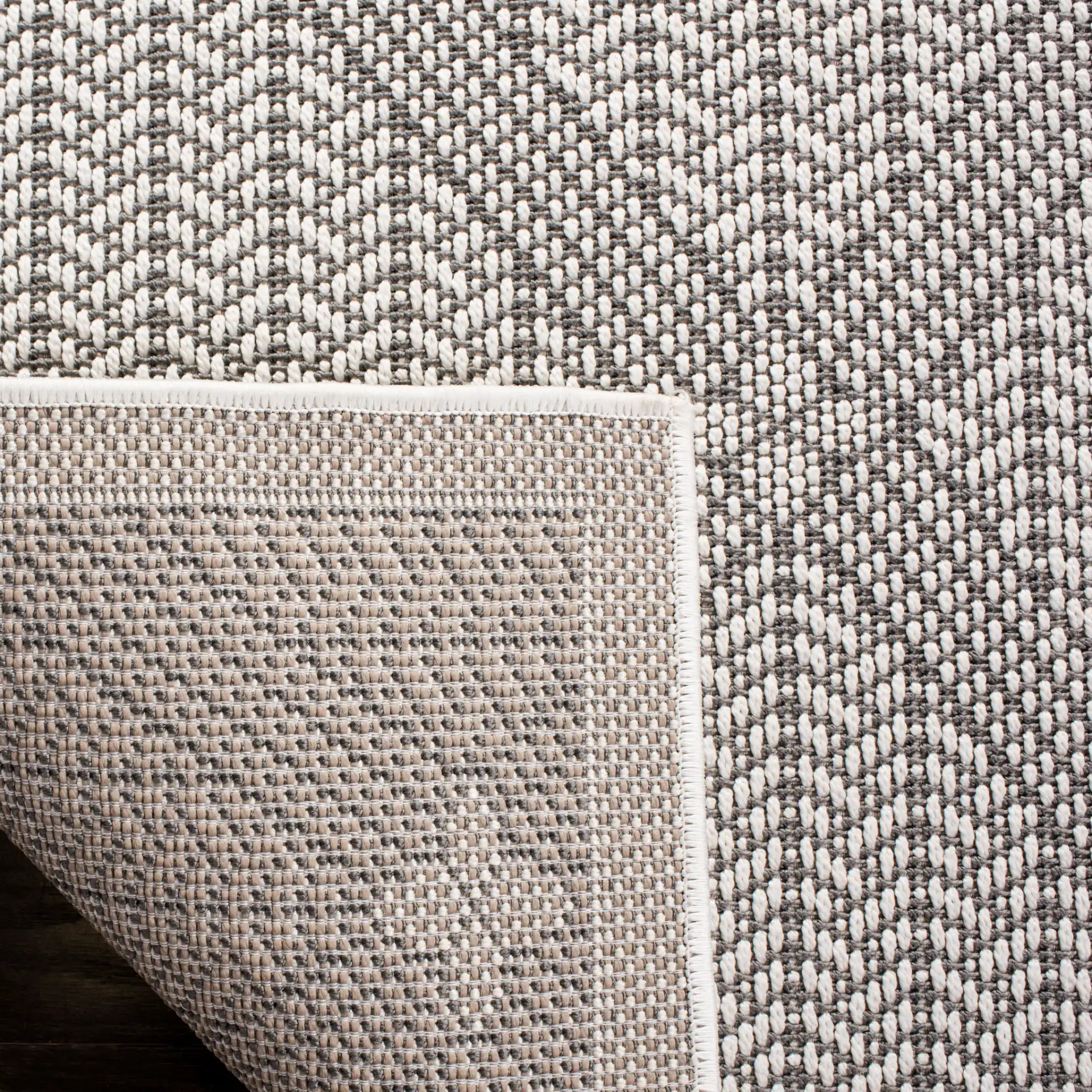 Bermuda Diamond Lattice Washable Outdoor Rug in Cream / Gray in a styled room