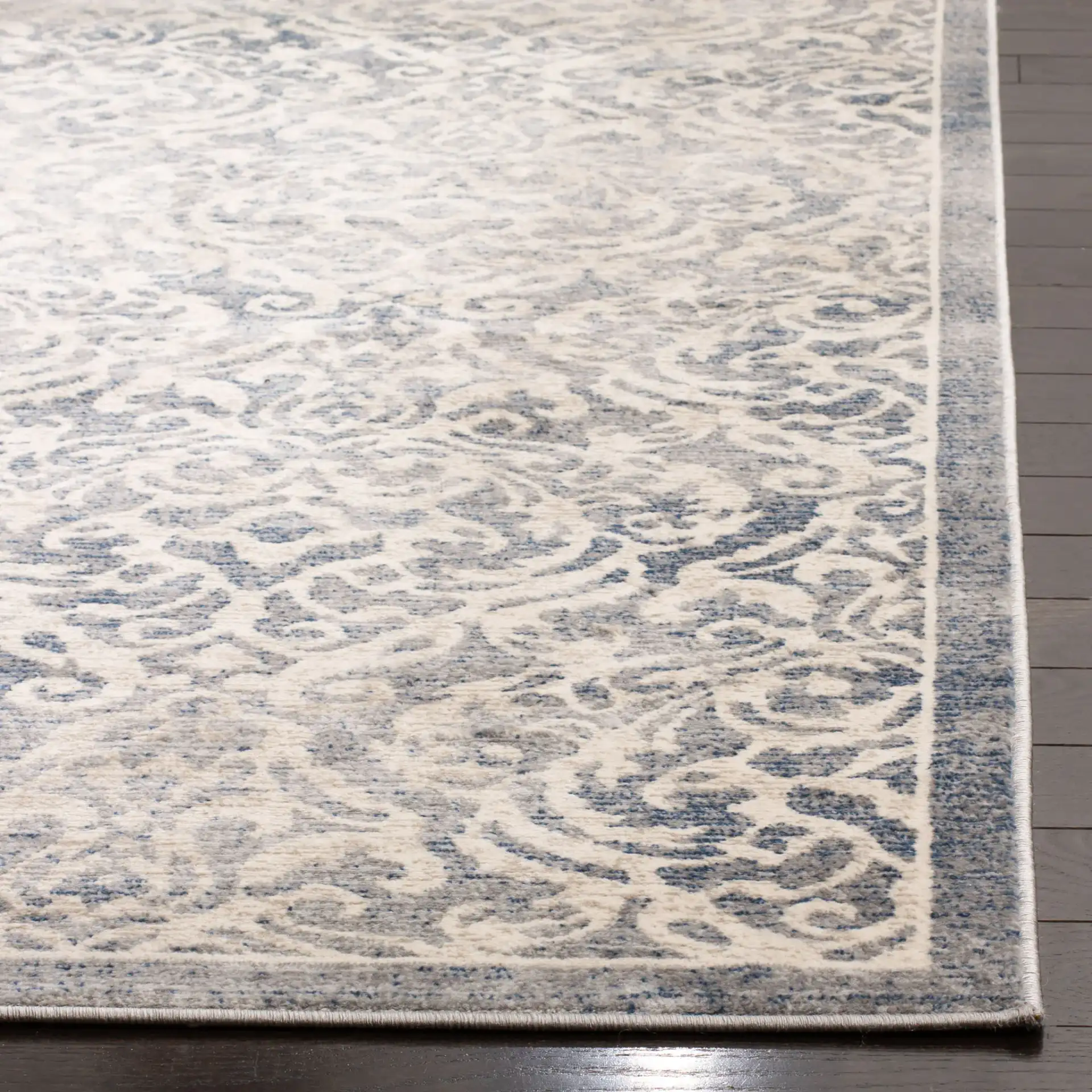 Brentwood Scroll Rug in Light Gray / Blue in a styled room