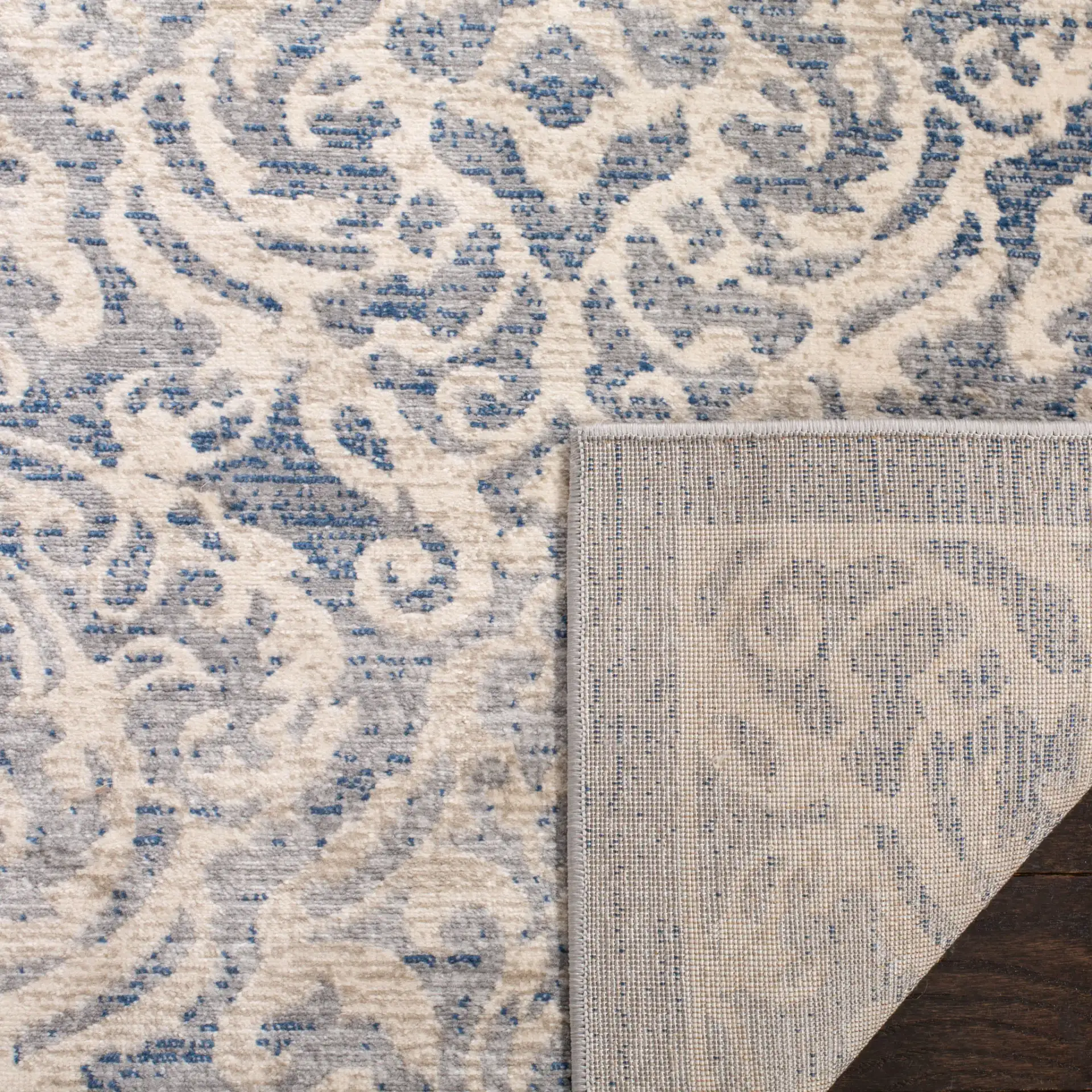 Brentwood Scroll Rug in Light Gray / Blue in a styled room