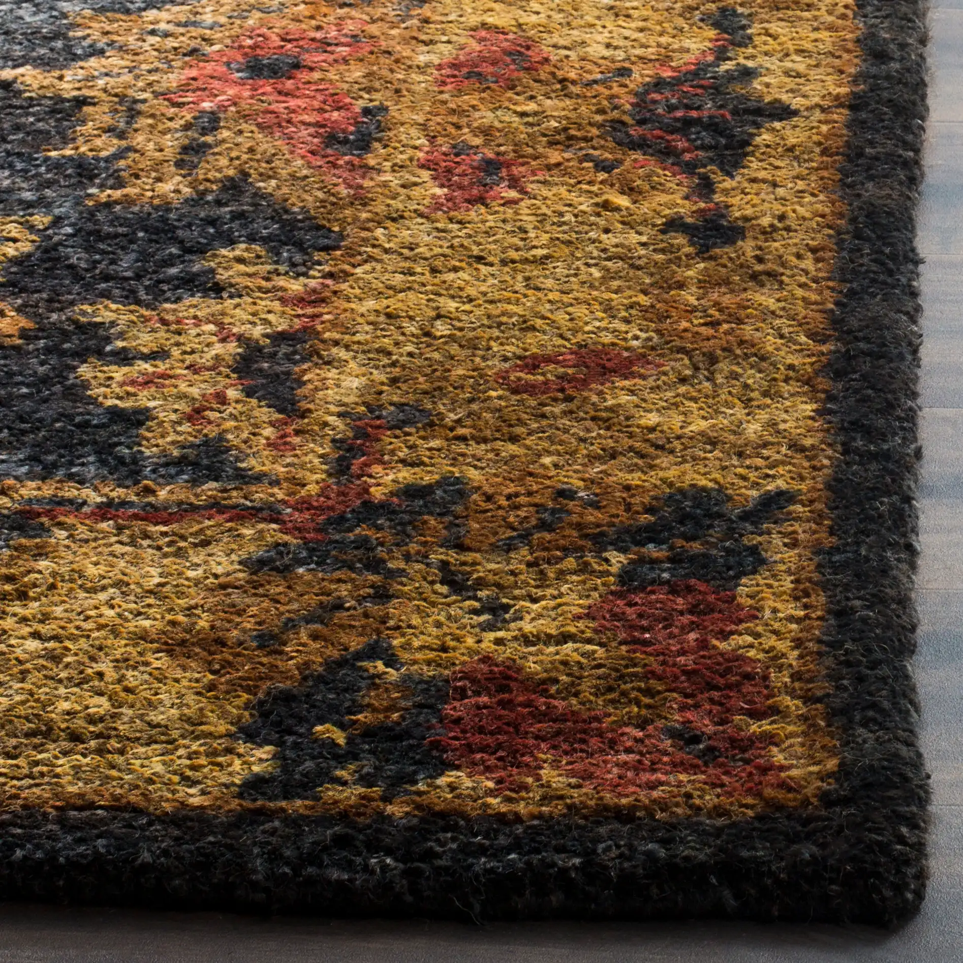 Bohemian Vine And Blossom Hand-Tufted Rug in Charcoal / Gold in a styled room
