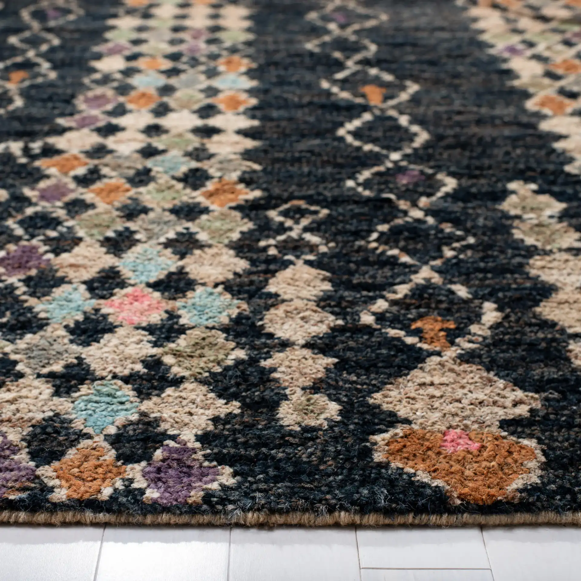 Bohemian Diamond Column Hand-Knotted Jute Rug in Black / Beige in a styled room