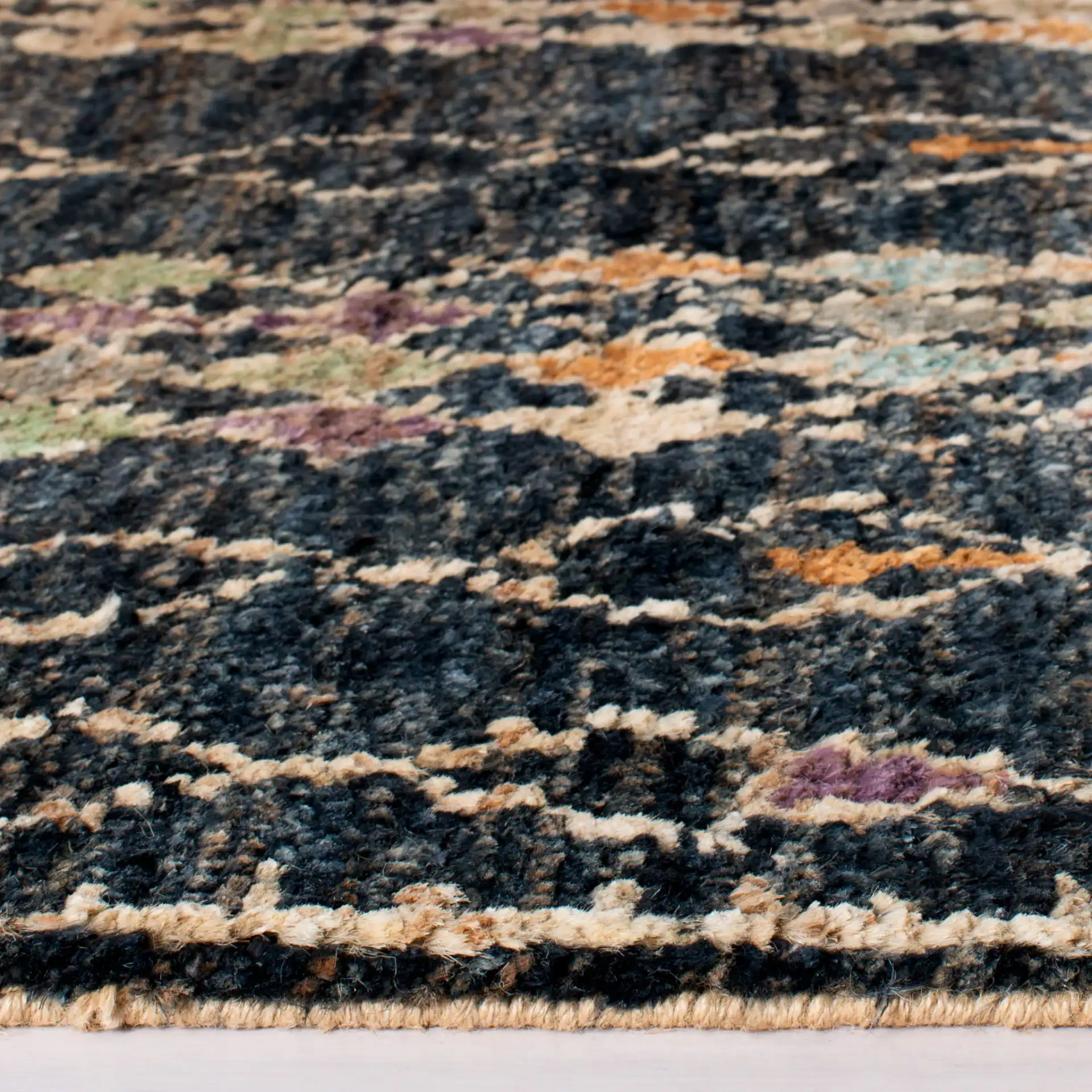 Bohemian Diamond Column Hand-Knotted Jute Rug in Black / Beige in a styled room