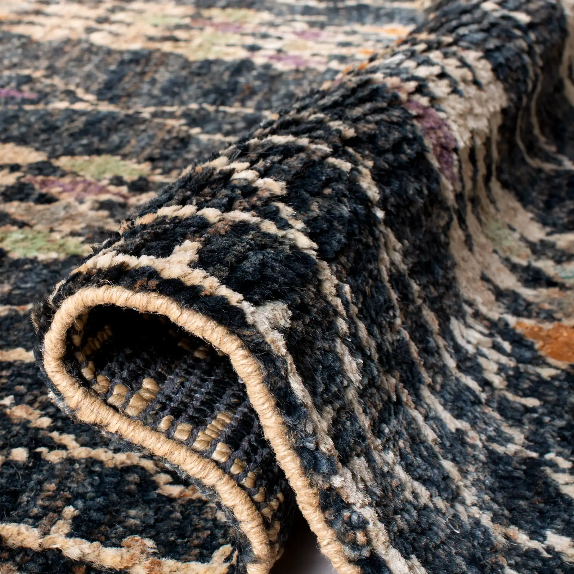 Bohemian Diamond Column Hand-Knotted Jute Rug in Black / Beige in a styled room