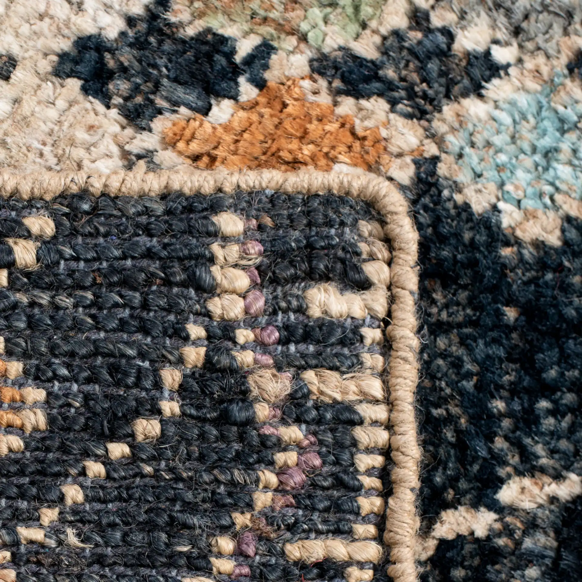 Bohemian Diamond Column Hand-Knotted Jute Rug in Black / Beige in a styled room